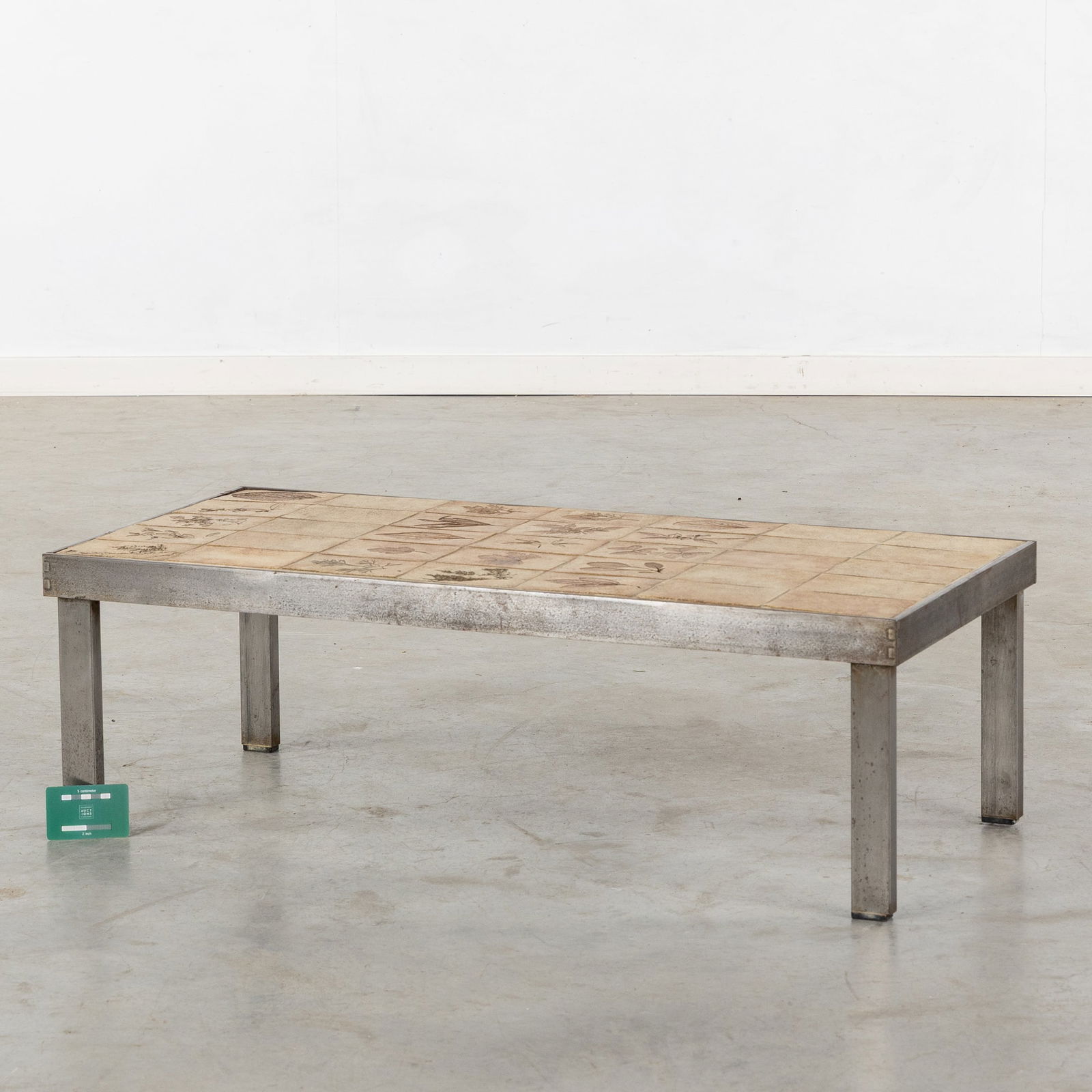 Roger Capron (1922-2006) 'Coffee table', ceramic and steel.: Roger Capron (1922-2006) 'Coffee table', ceramic and steel. a coffee table finished with ceramic tiles and imprints of leaves and ferns. 