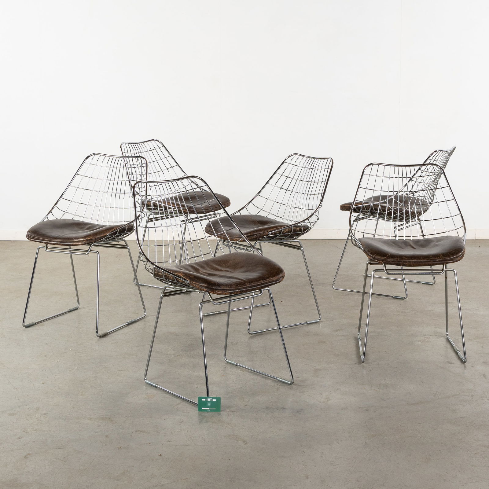 Cees Braakman (1917-1995) 'SM05' for Pastoe, with cushions made by Durlet.: Cees Braakman (1917-1995) 'SM05' for Pastoe, with cushions made by Durlet. Cees Braakman for Pastoe. 6 chairs, chromed metal and leather. The cushions are signed Durlet. Circa