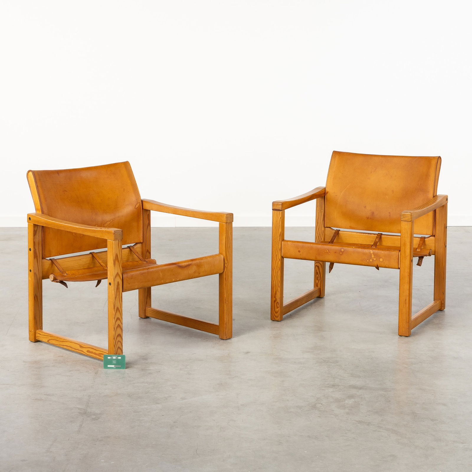 Karin Mobring (1927-2005) 'Diana' a pair of lounge chairs.: Karin Mobring (1927-2005) 'Diana' a pair of lounge chairs. Pine wood mounted with leather. Dimensions:(W:63 x H:71 x L:63 cm)