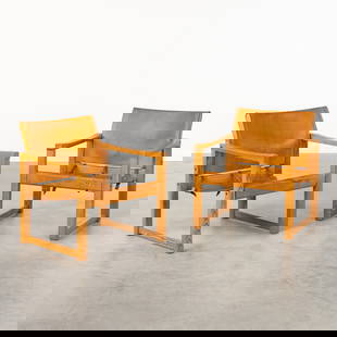 Karin Mobring (1927-2005) 'Diana' a pair of lounge chairs.: Karin Mobring (1927-2005) 'Diana' a pair of lounge chairs. Pine wood mounted with leather. Dimensions:(W:63 x H:71 x L:63 cm)