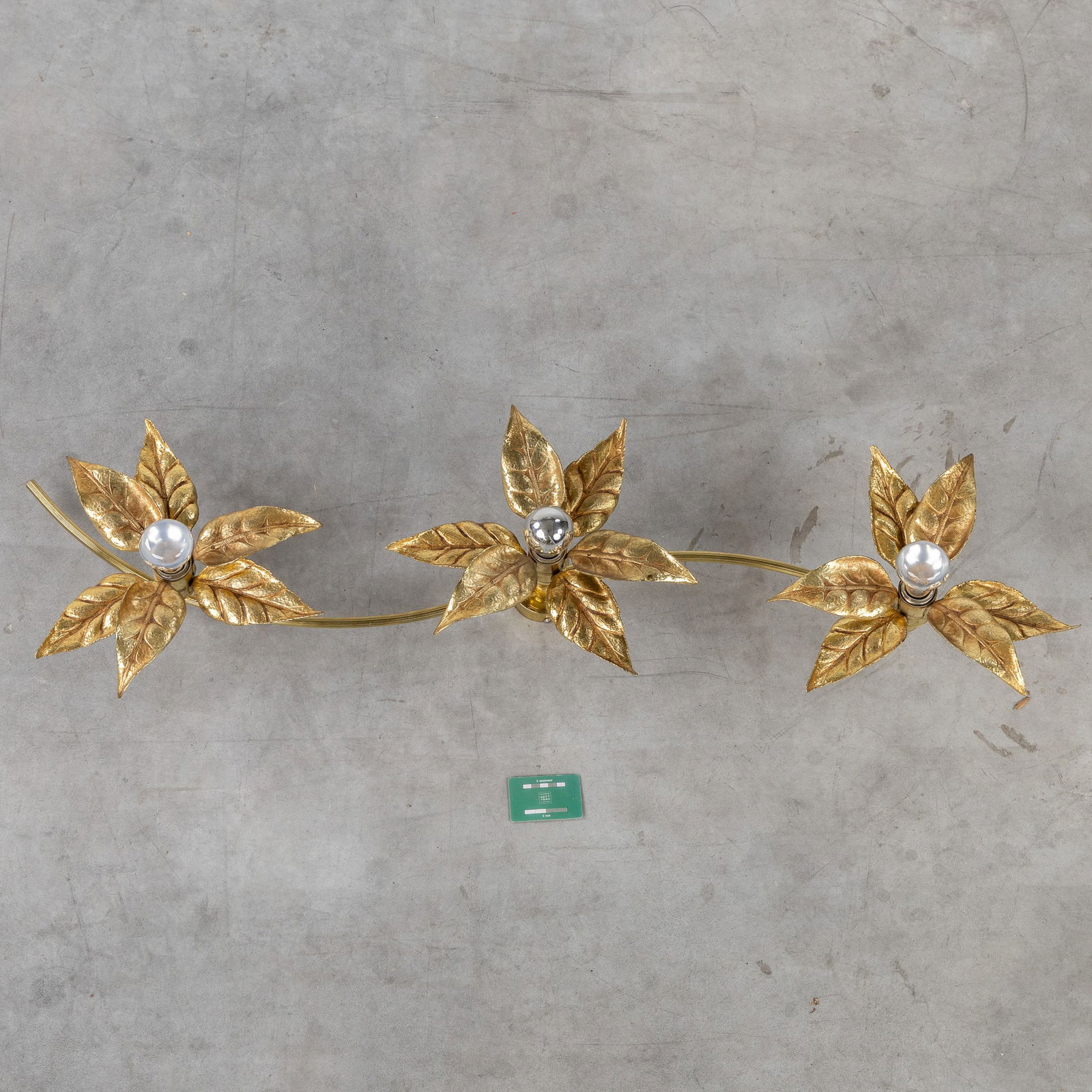 Willy Daro (1918-1990) (Attr.), A wall lamp 'Flowers', for Massive, Belgium, circa 1970.: Willy Daro (1918-1990) (Attr.), A wall lamp 'Flowers', for Massive, Belgium, circa 1970. A wall lamp with three light points.Gilded metal.Design for Massive, Belgium.Not signed.
