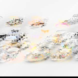 A Collection of 14 Moustache Cups and Saucers. Added two cups.: A Collection of 14 Moustache Cups and Saucers. Added two cups and saucers. 14 moustache cups, 10 of which with matching saucer. The moustache cup (or moustache cup) is a cup with a semicircular rim