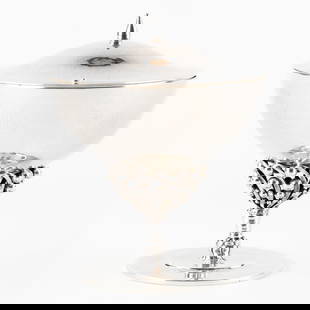 Johan Rohde (1856-1935) a Silver Bonbonniere or Tazza (1928) for Georg Jensen, Denmark. Silver, 417g: Johan Rohde (1856-1935) a Silver Bonbonniere or Tazza (1928) for Georg Jensen, Denmark. Silver. A silver bonbonniere or tazza with lid.Hammered chalice and lid. Stem with openwork bead