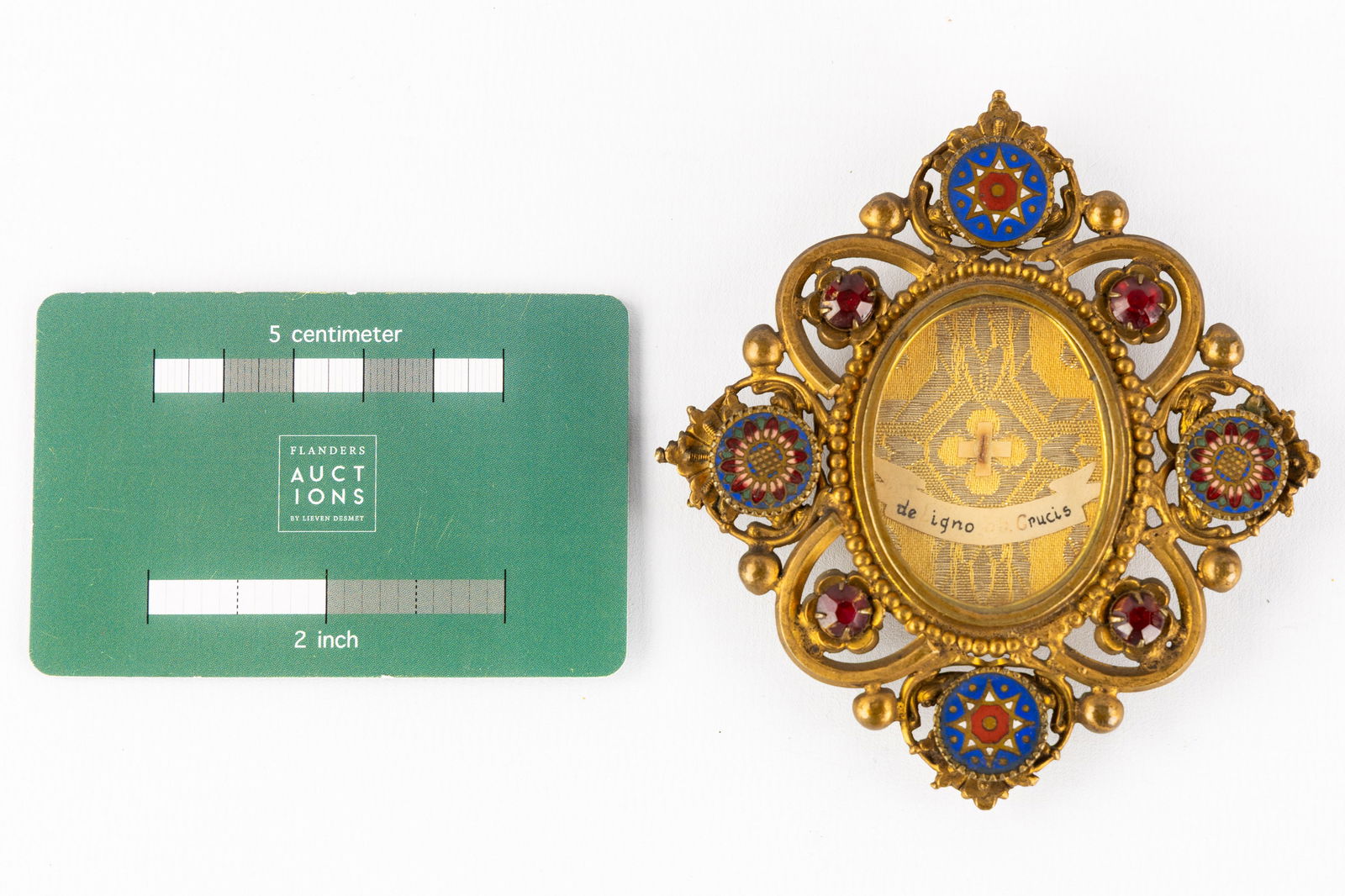 A brass reliquary holder decorated wtih enamel, with a sealed relic of the True Cross. (1 of 3)