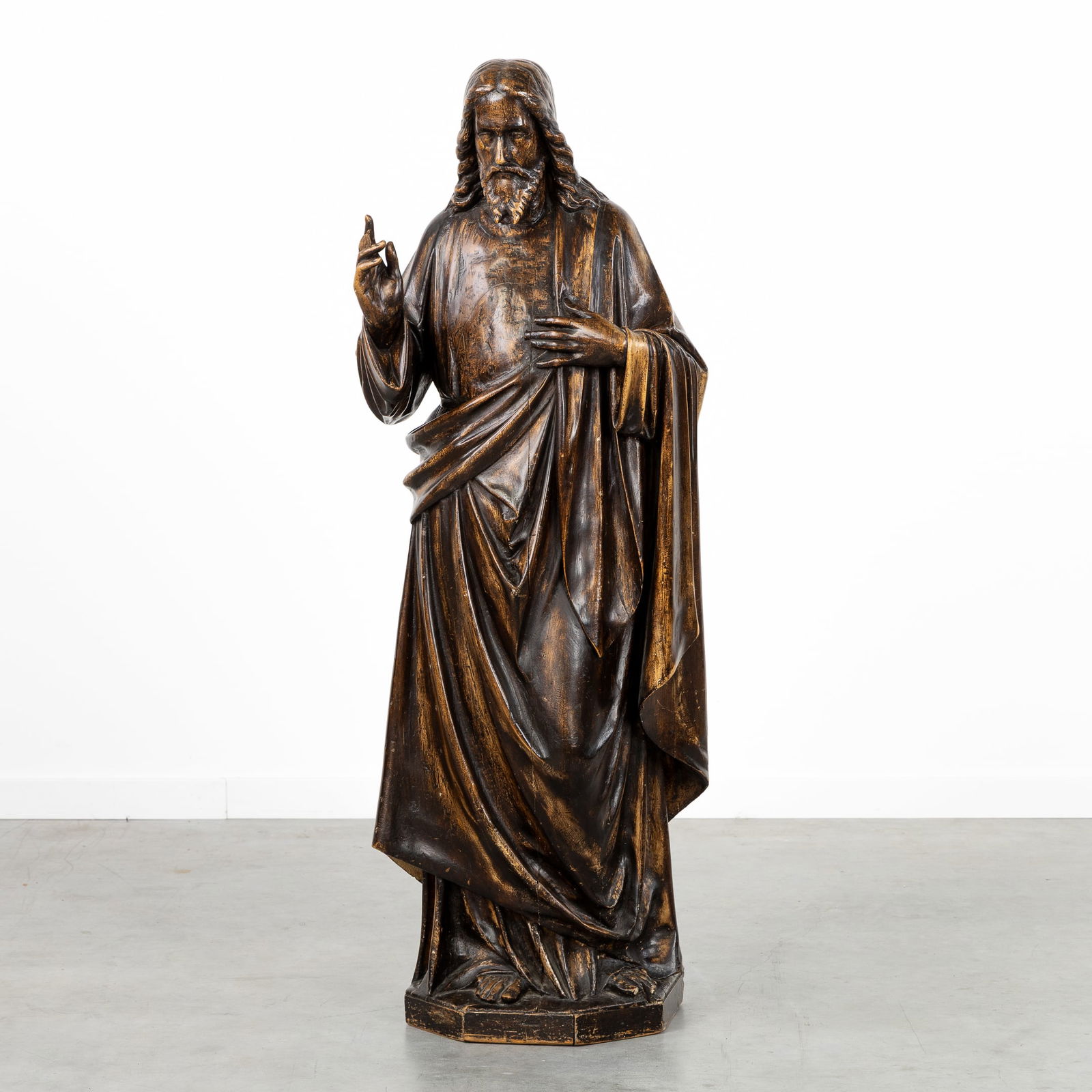 An antique wood-sculptured figurine of Jesus Christ, brown patinated wood. 19th C. (1 of 9)