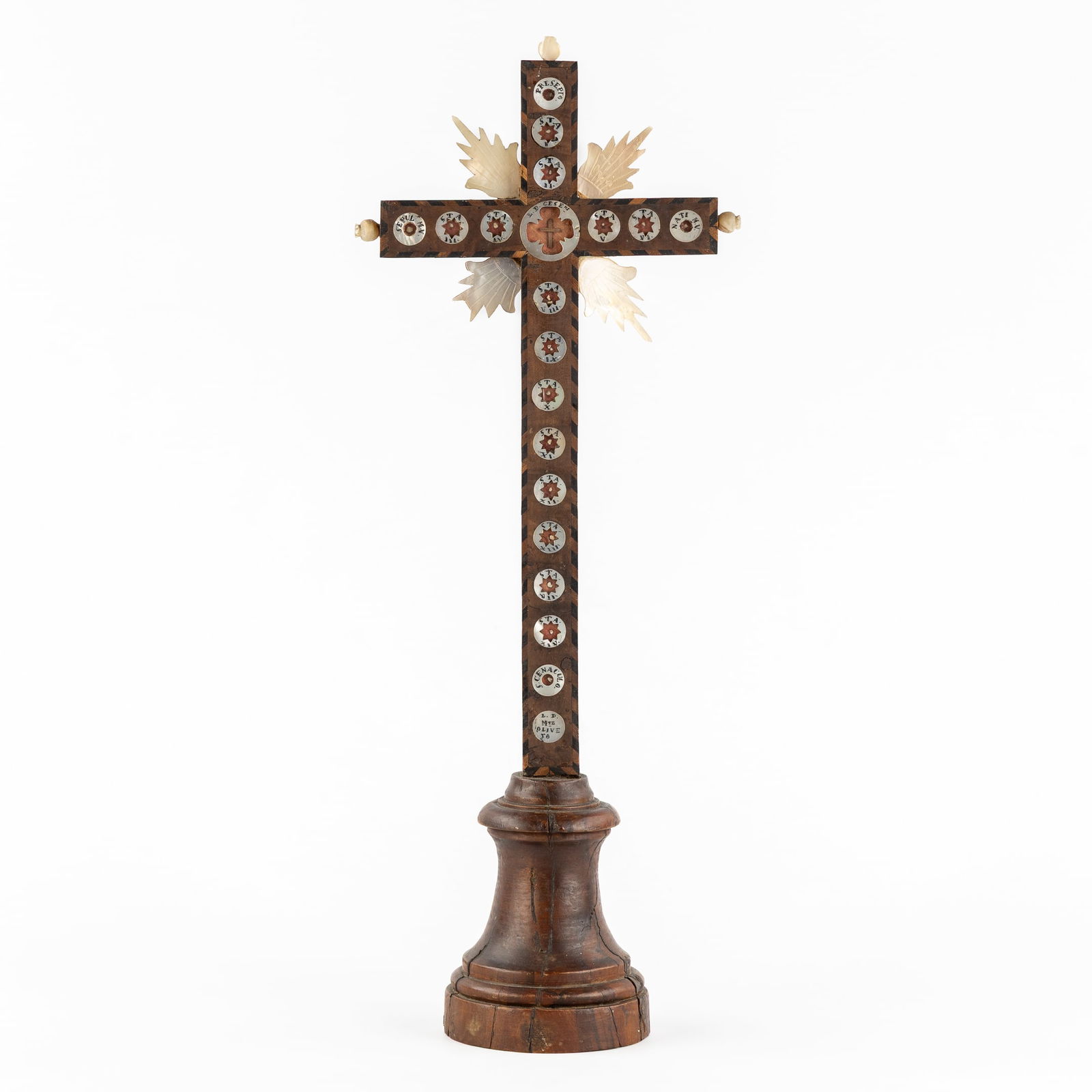 A Reliquary Crucifix with Mother-of-Pearl. With Relics for the True Cross, 14 Stations of the Cross: A Reliquary Crucifix with Mother-of-Pearl. With Relics for the True Cross, 14 Stations of the Cross and others. circa 1900. Wooden reliquary crucifix decorated with mother-of-pearl and finished with e