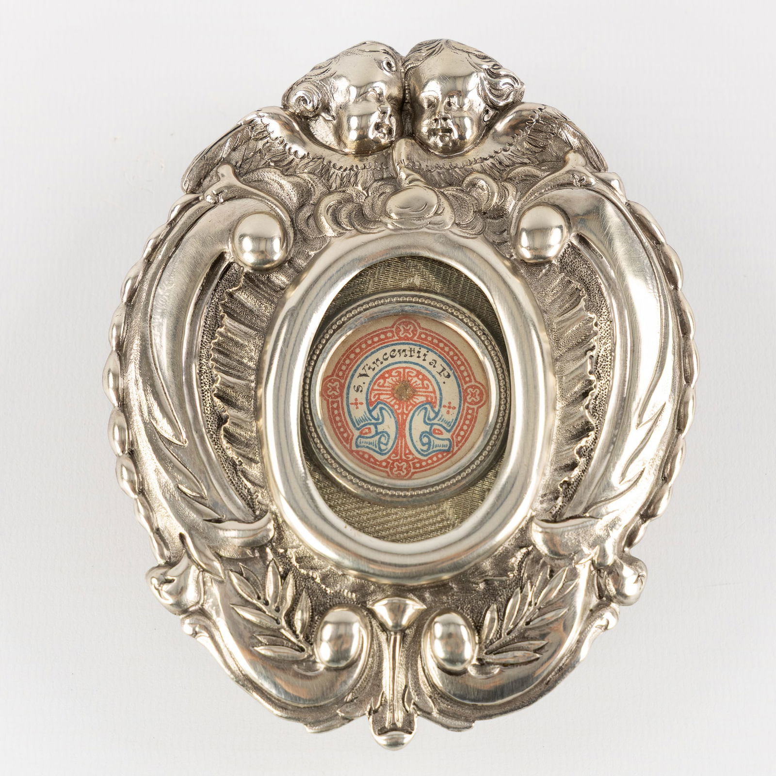 A Sealed Theca in a Silver Osculatorium, with Relic for Saint Vincent de Paul. Silver, 104g. (1 of 5)