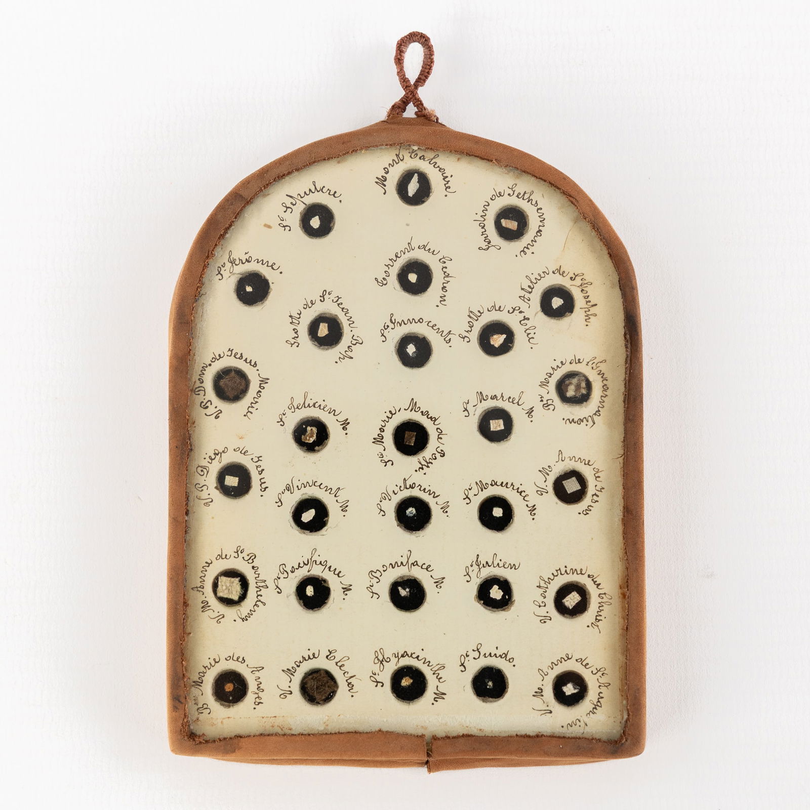 A reliquary frame with 59 relics, Apostles, Saints. Circa 1900. (1 of 2)