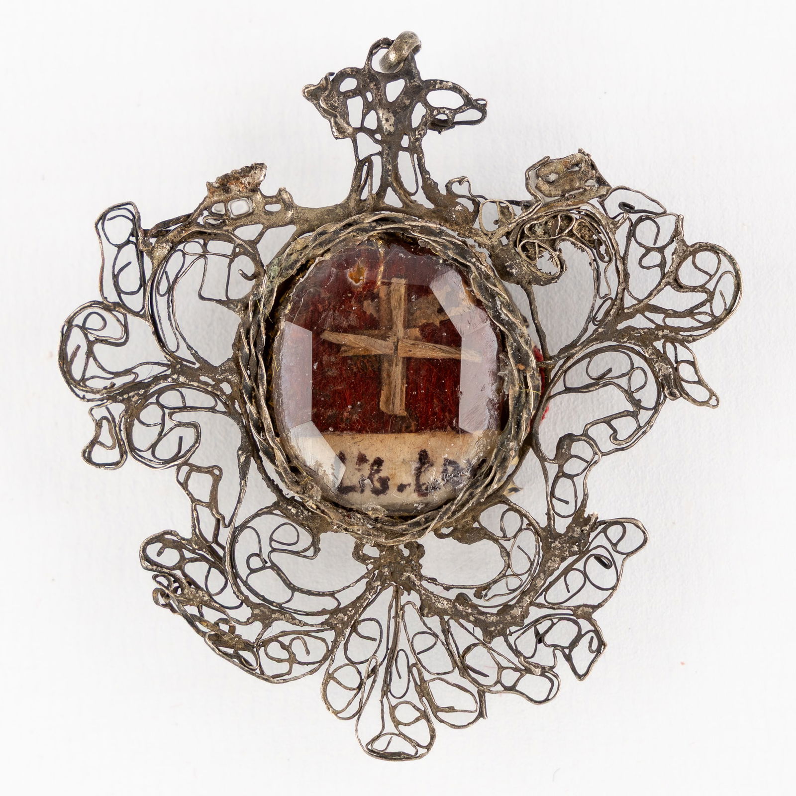 A sealed theca with a relic of the True Cross, De Ligno Cruxis DNJC. (1 of 2)