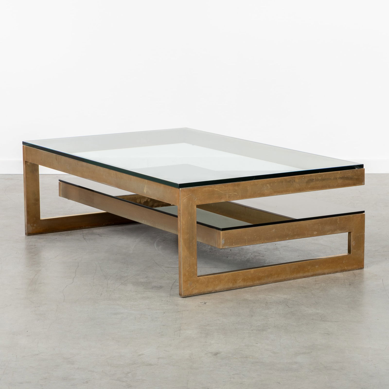 Belgo Chrome, Meutabel, A G-shaped Coffee Table. Gilded Metal and Glass. Circa 1970.: Belgo Chrome, Meutabel, A G-shaped Coffee Table. Gilded Metal and Glass. Circa 1970. Gilded metal and glass. Designed by Ignace Opsomer, for Meutabel. Manufactured by Meutabel or Belgo Chrome. Circa 1