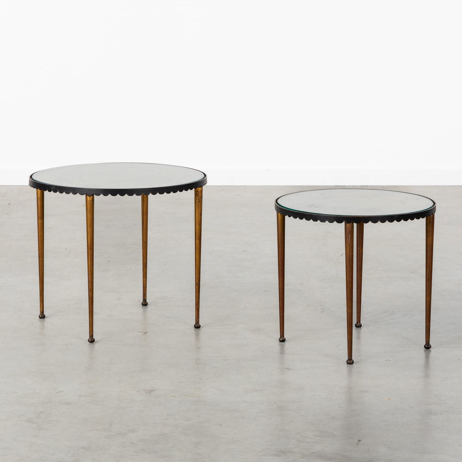 A Pair of Side Tables in the Style of Mathieu Matégot, Patinated and Perforated Metal and Glass.: A Pair of Side Tables in the Style of Mathieu Matégot, Patinated and Perforated Metal and Glass. Patinated metal and glass.Two side tables (H: 41 cm x D: 48 cm / H: 38 cm x D: 41 cm)In the style of