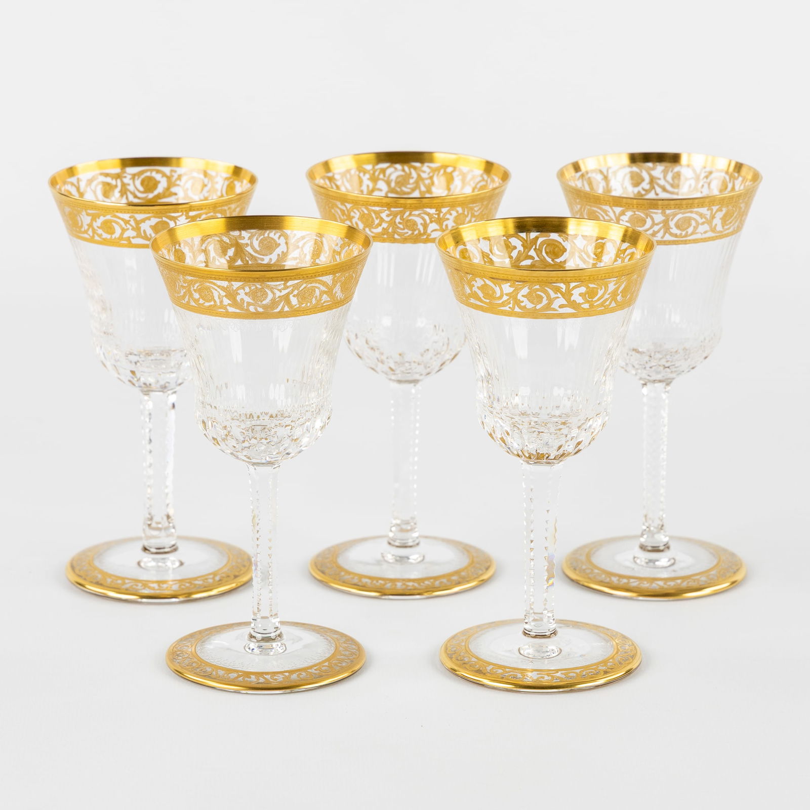 Saint Louis, 'Thistle Gold', A Set of 5 White Wine Glasses, Engraved Decorations and Etched Gold: Saint Louis, 'Thistle Gold', A Set of 5 White Wine Glasses, Engraved Decorations and Etched Gold Decoration. Five glasses, cut and etched crystal.'Thistle Gold' decoration.One glass marked 'Saint-Lo