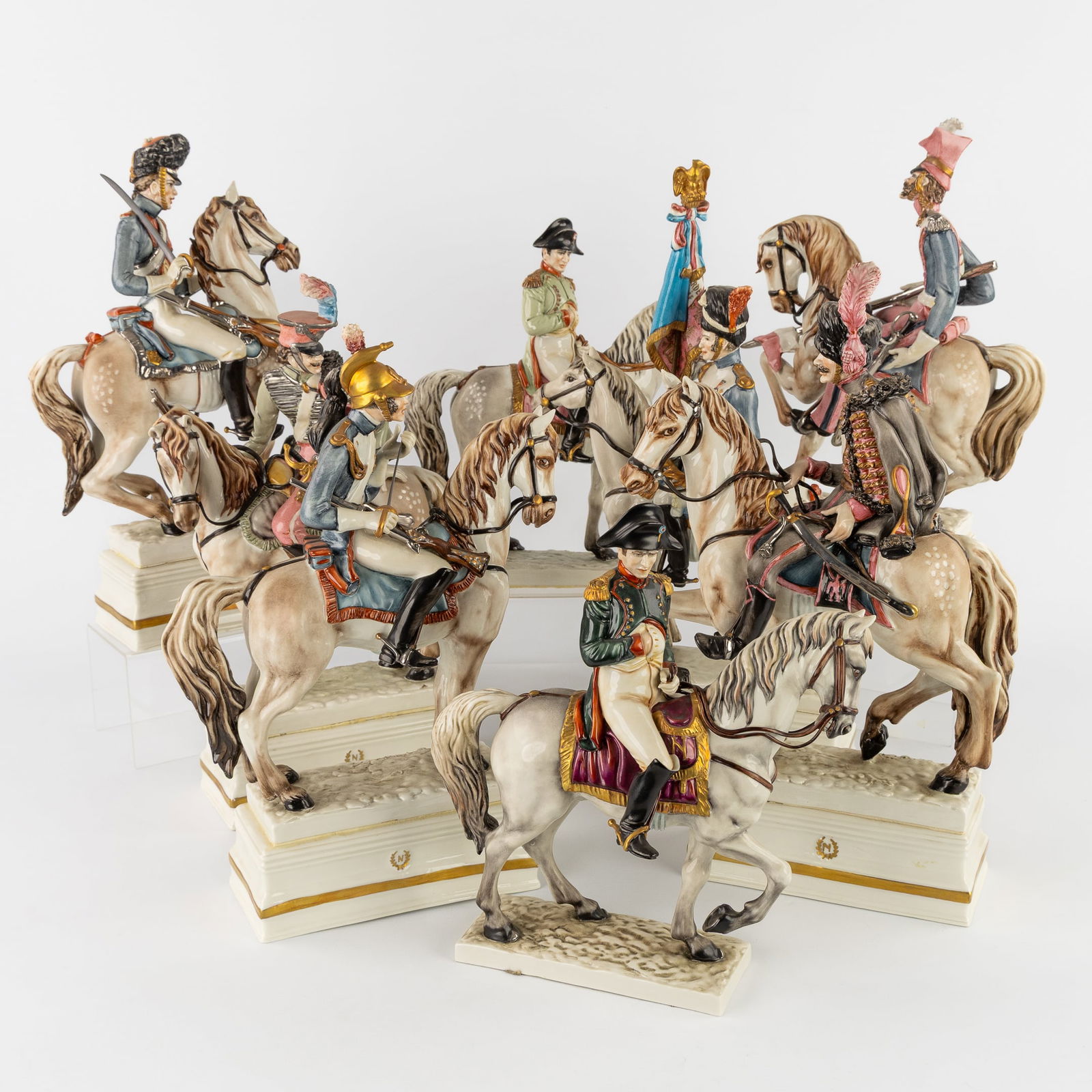 Guido Cacciapuoti (1892-1953) A Collection of 8 Napoleonic Horsemen Figurines, Polychrome Porcelain.: Guido Cacciapuoti (1892-1953) A Collection of 8 Napoleonic Horsemen Figurines, Polychrome Porcelain. Italy, 20th century. Polychrome porcelain. All signed 'Cacciapuoti'.