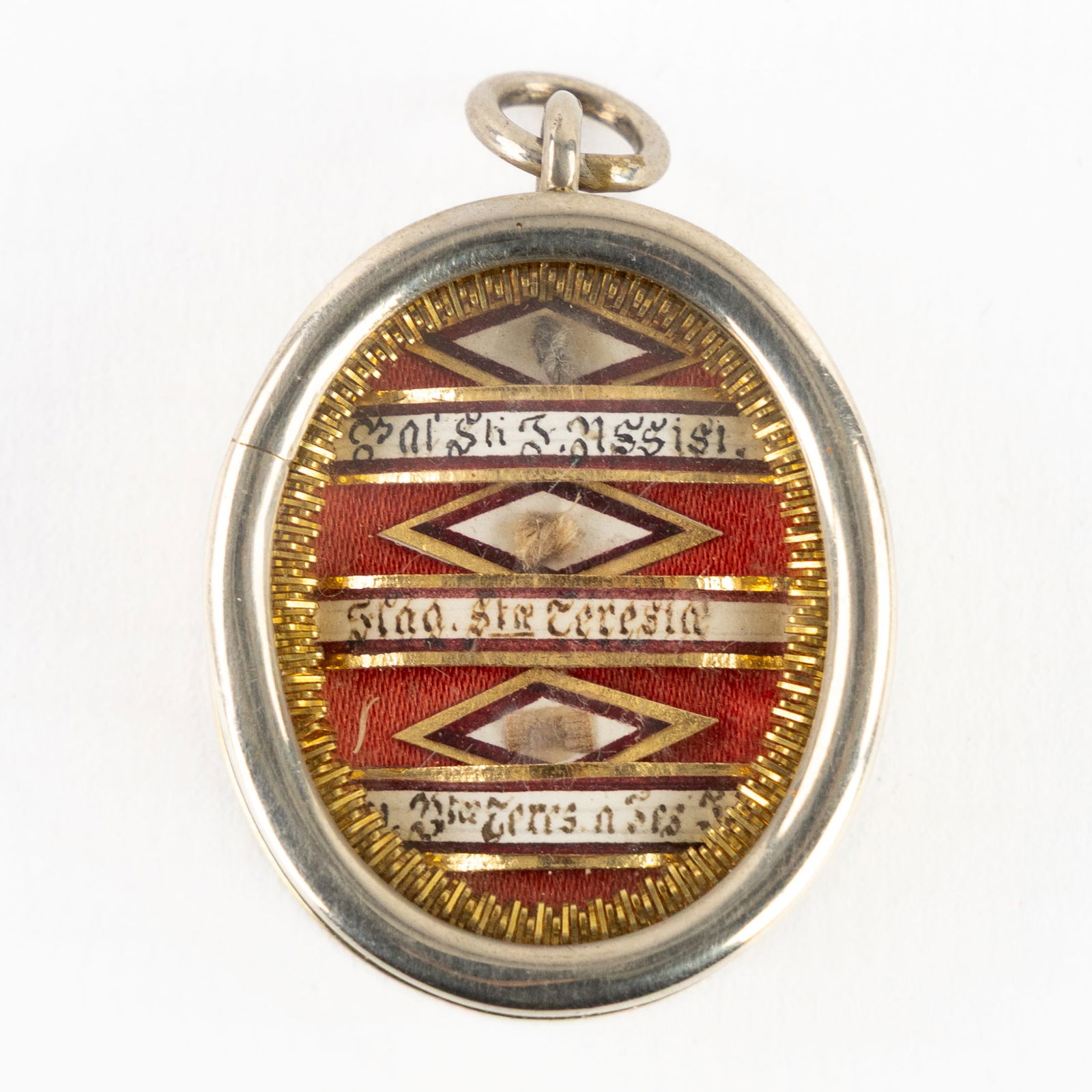 A sealed multi-theca with relics for Saint Francis of Assisi, Thérèse of Lisieux and Saint Teresa (1 of 3)