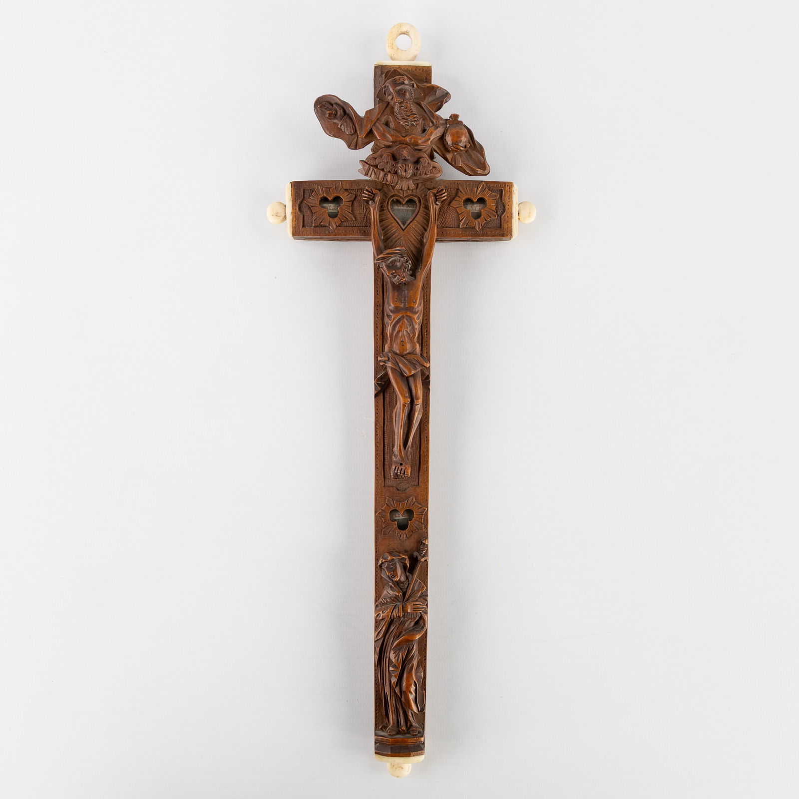 A Wood-Sculptured Reliquary Crucifix with 13 Relics, decorated with Instruments of the Passion and (1 of 9)