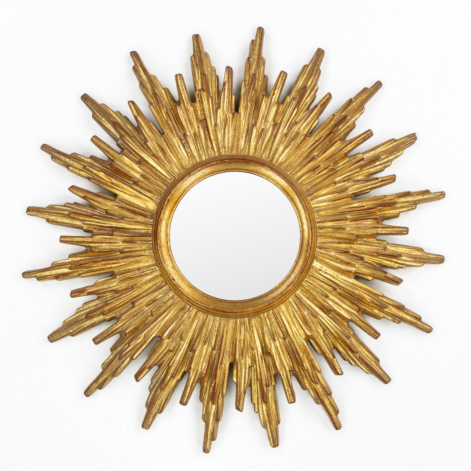 Deknudt, A Mid-Century Sunburst Mirror, Gilded, Convex Glass. Circa 1970.