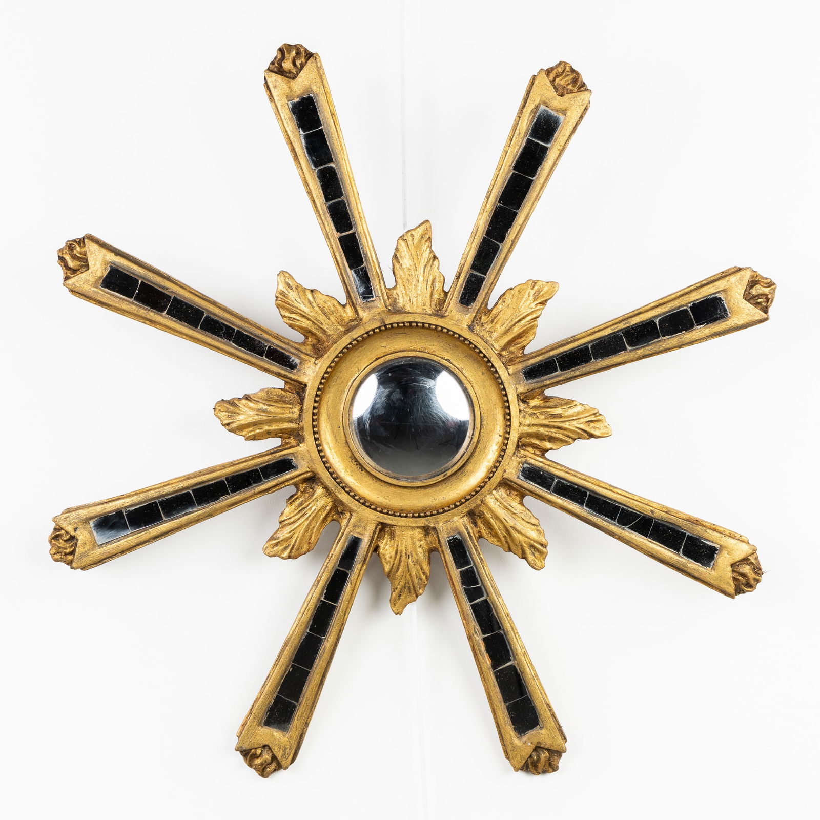 A Mid-Century Sunburst Mirror, Gilded, Convex Glass. Circa 1970.: A Mid-Century Sunburst Mirror, Gilded, Convex Glass. Circa 1970. Convex glass.Gilded resin.Sunbursts finished with mirror pieces.Circa 1970.