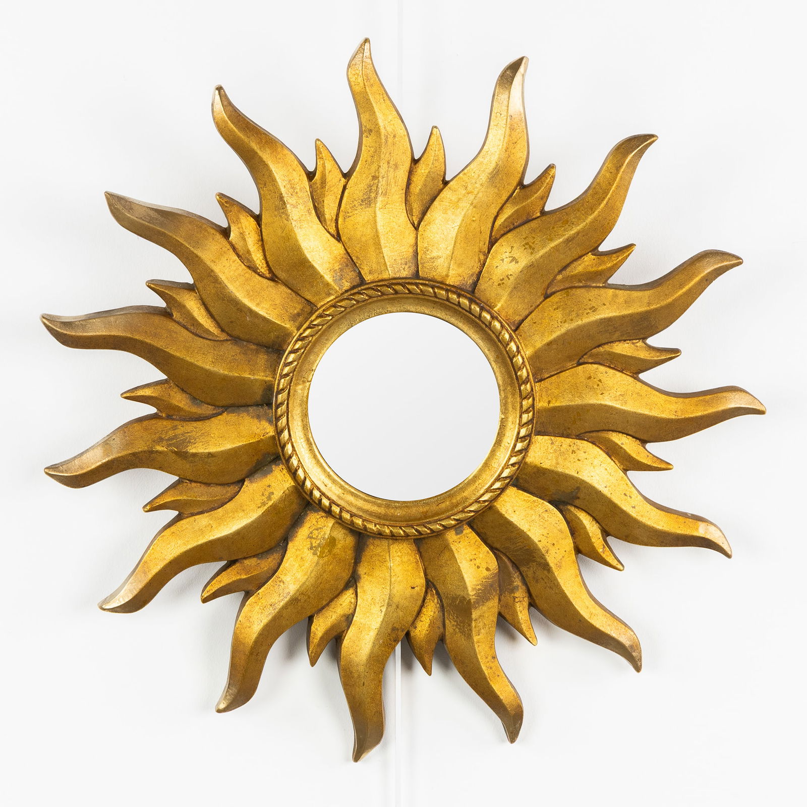 A Mid-Century Sunburst Mirror, Gilded, Convex Glass. Circa 1970.: A Mid-Century Sunburst Mirror, Gilded, Convex Glass. Circa 1970. Convex glass.Gilded resin.Circa 1970.