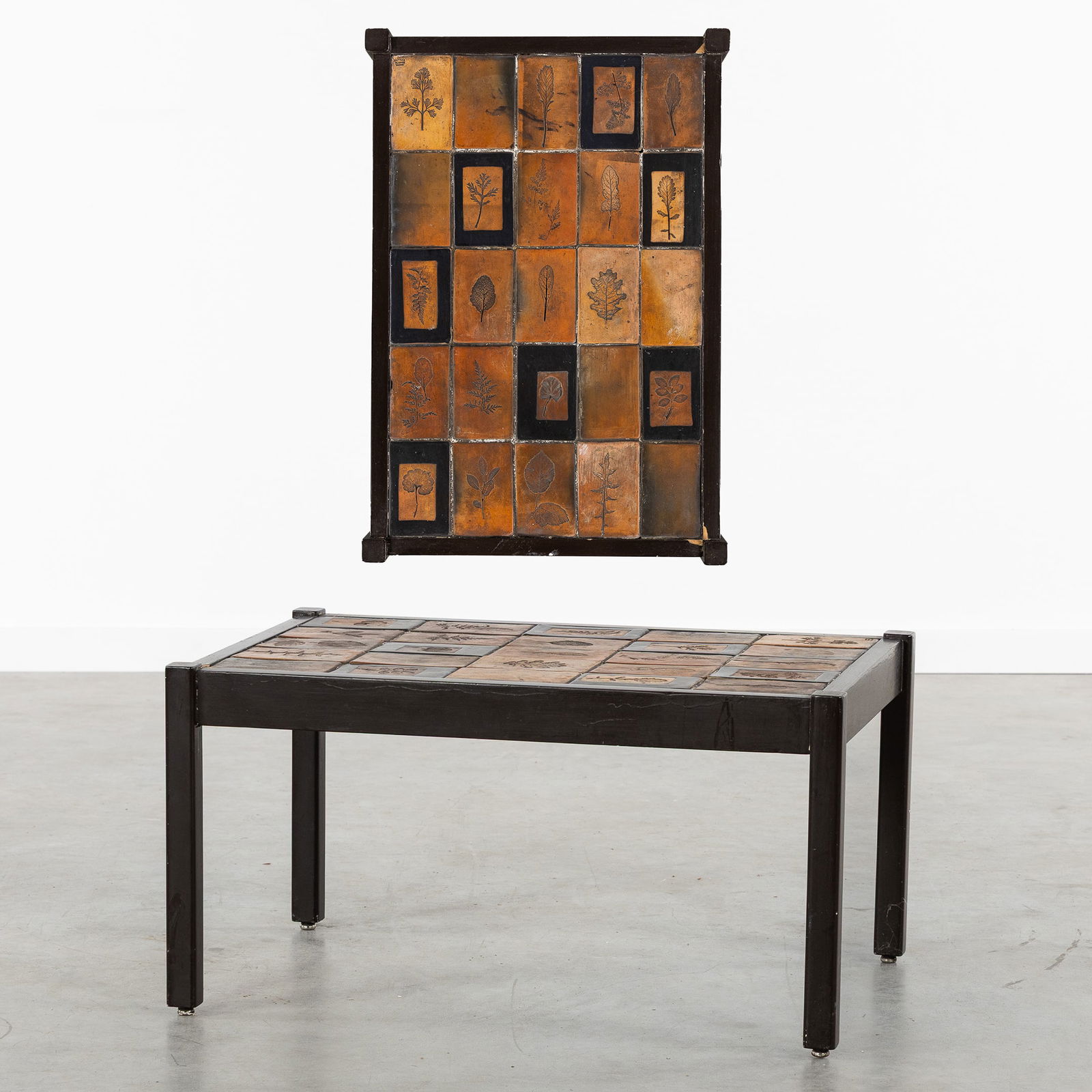 Roger Capron (1922-2006) A Small Coffee Table, Ceramic and Patinated Wood.: Roger Capron (1922-2006) A Small Coffee Table, Ceramic and Patinated Wood. A coffee table finished with tiles, decorated with prints of leaves and plants.Wooden base and table legs.Signed Roger Capron