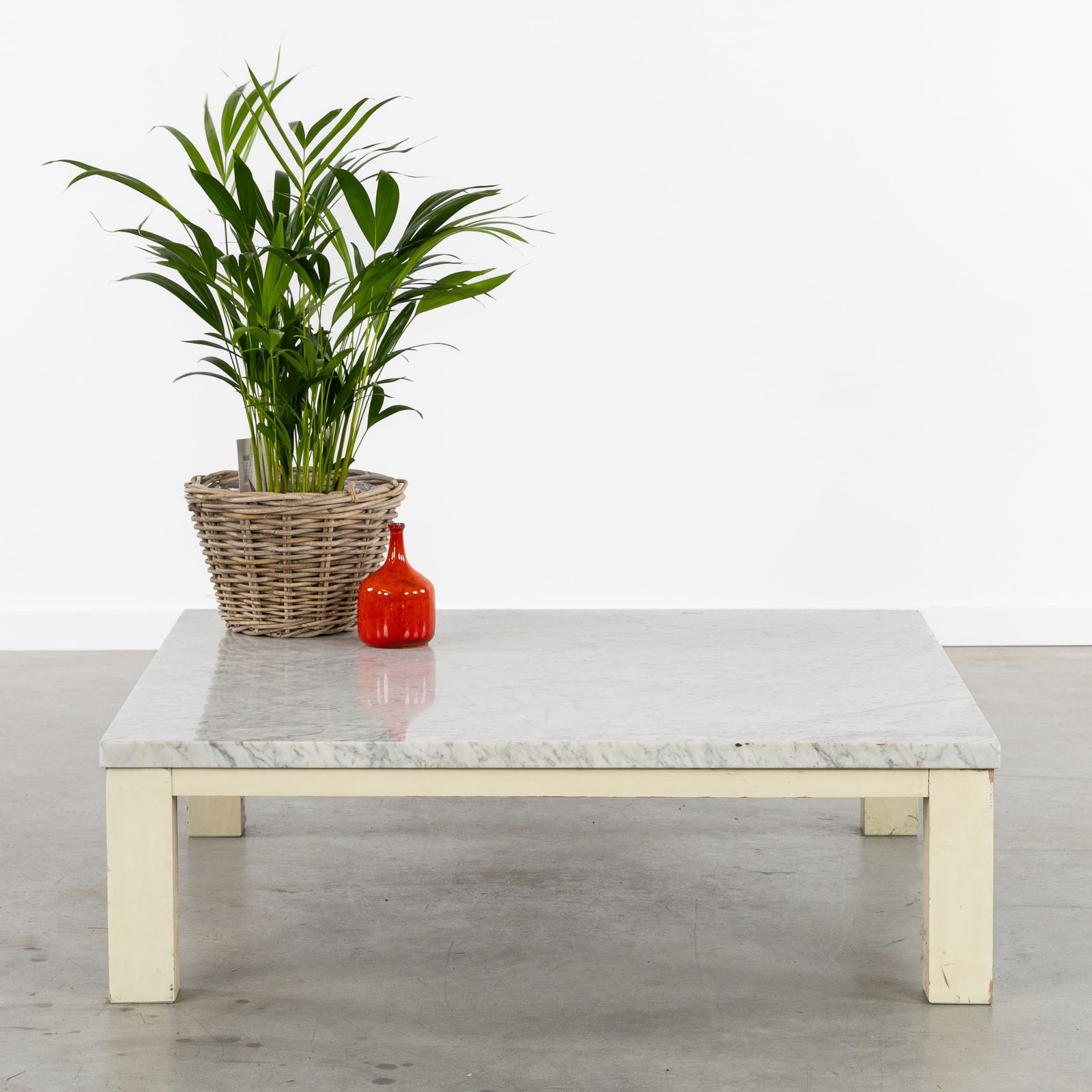 A Mid-Century Coffee Table, Carrara Marble and Wood, circa 1970.: A Mid-Century Coffee Table, Carrara Marble and Wood, circa 1970. White Carrara marble and white patinated wood.A large low coffee table.Mid-Century, circa 1970.