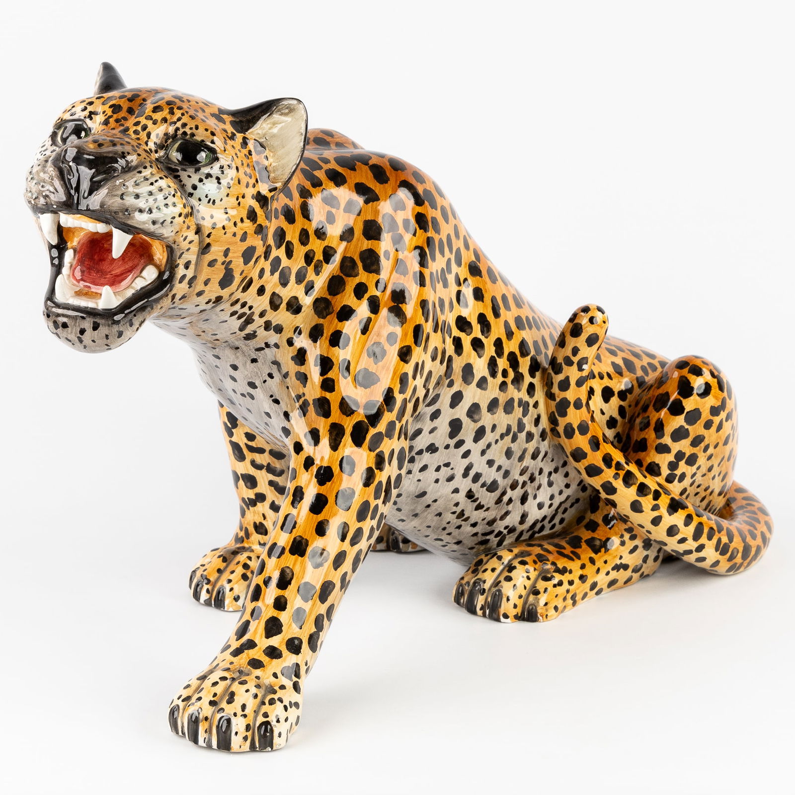 A Mid-Century sculpture of a leopard, glazed ceramic. Italy. Circa 1980.: A Mid-Century sculpture of a leopard, glazed ceramic. Italy. Circa 1980.
