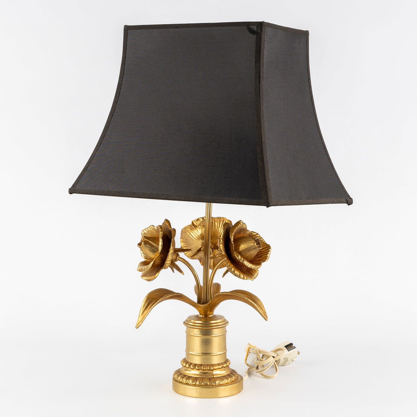Deknudt, 'Roses', a Table Lamp, Hollywood Regency style, Circa 1970.: Deknudt, 'Roses', a Table Lamp, Hollywood Regency style, Circa 1970. A table lamp featuring three roses.In the style of Maison Jansen.?Circa 1970. Dimensions include the original lampshade.