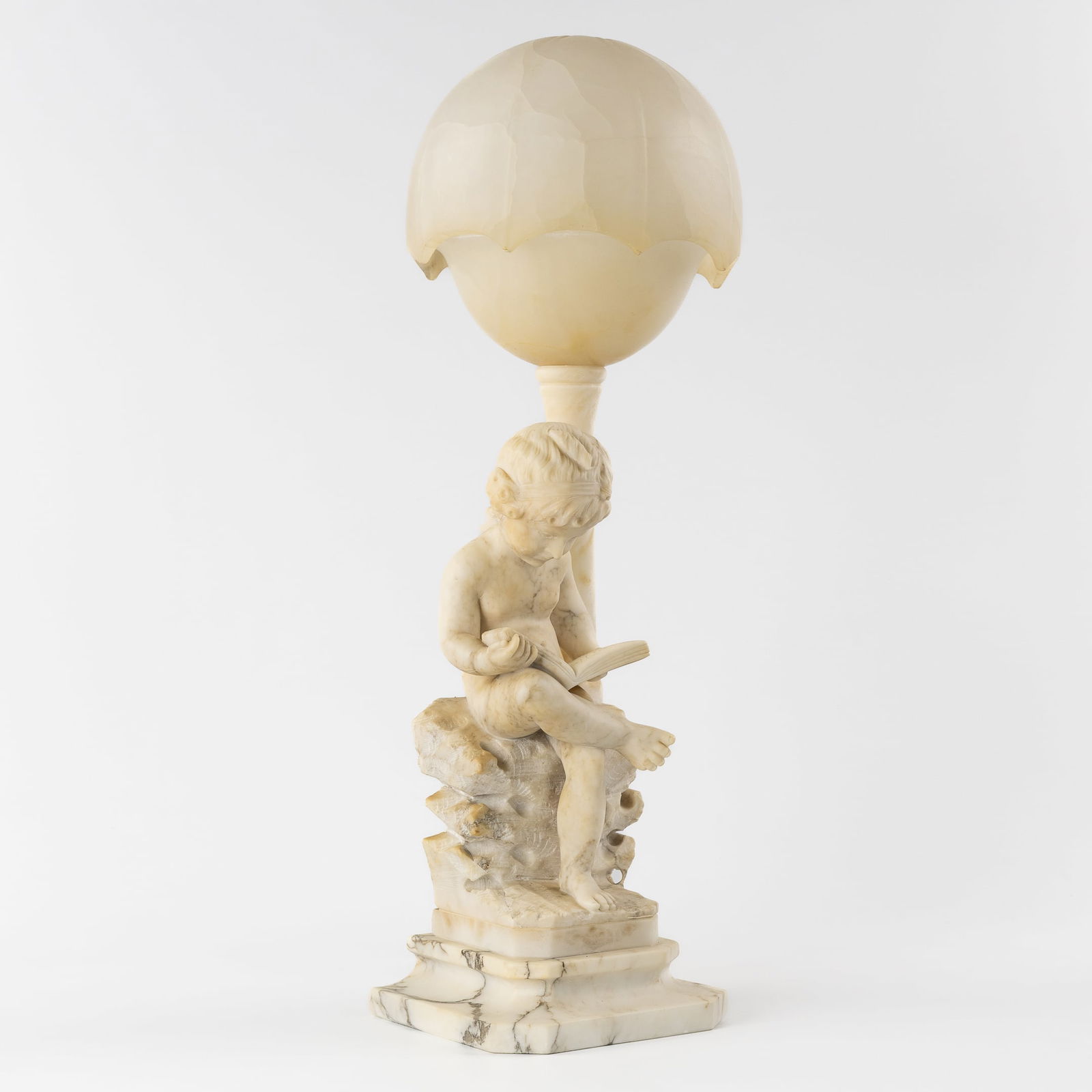 An Alabaster Lamp with a Reading Child, after Antonio Canova (1757-1822), Signed Prof. M. Del: An Alabaster Lamp with a Reading Child, after Antonio Canova (1757-1822), Signed Prof. M. Del Colombo. Italy, 19th/20th century. Alabaster sculpture of a Reading Child, after Antonio Canova (1757-1822