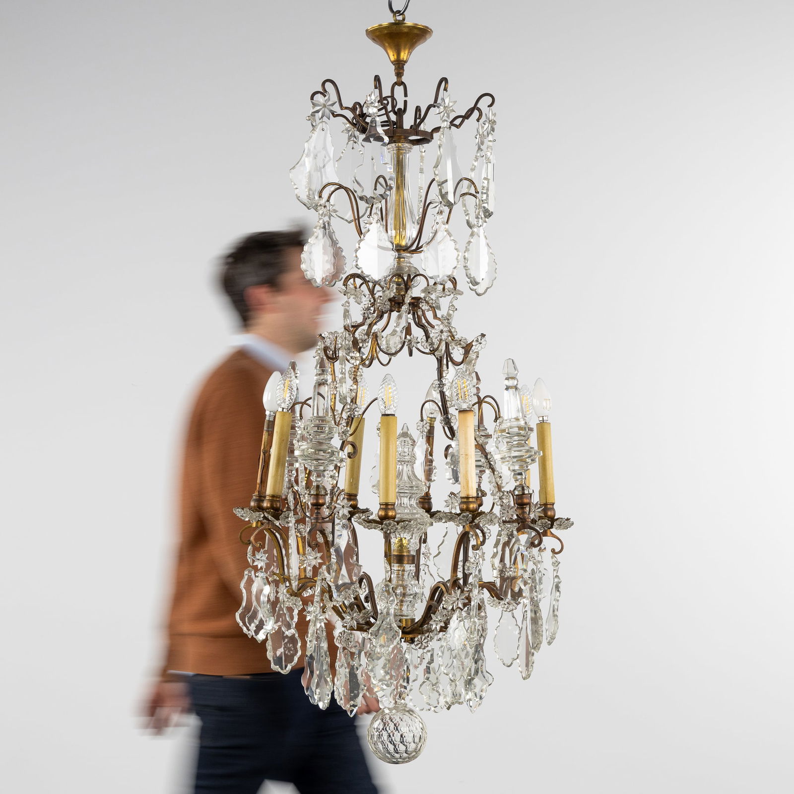 A Large Decorative Chandelier, Brass, richly mounted with Cut Crystal.: A Large Decorative Chandelier, Brass, richly mounted with Cut Crystal. Brass and cut crystal.8 lightpoints.Circa 1920-1940.
