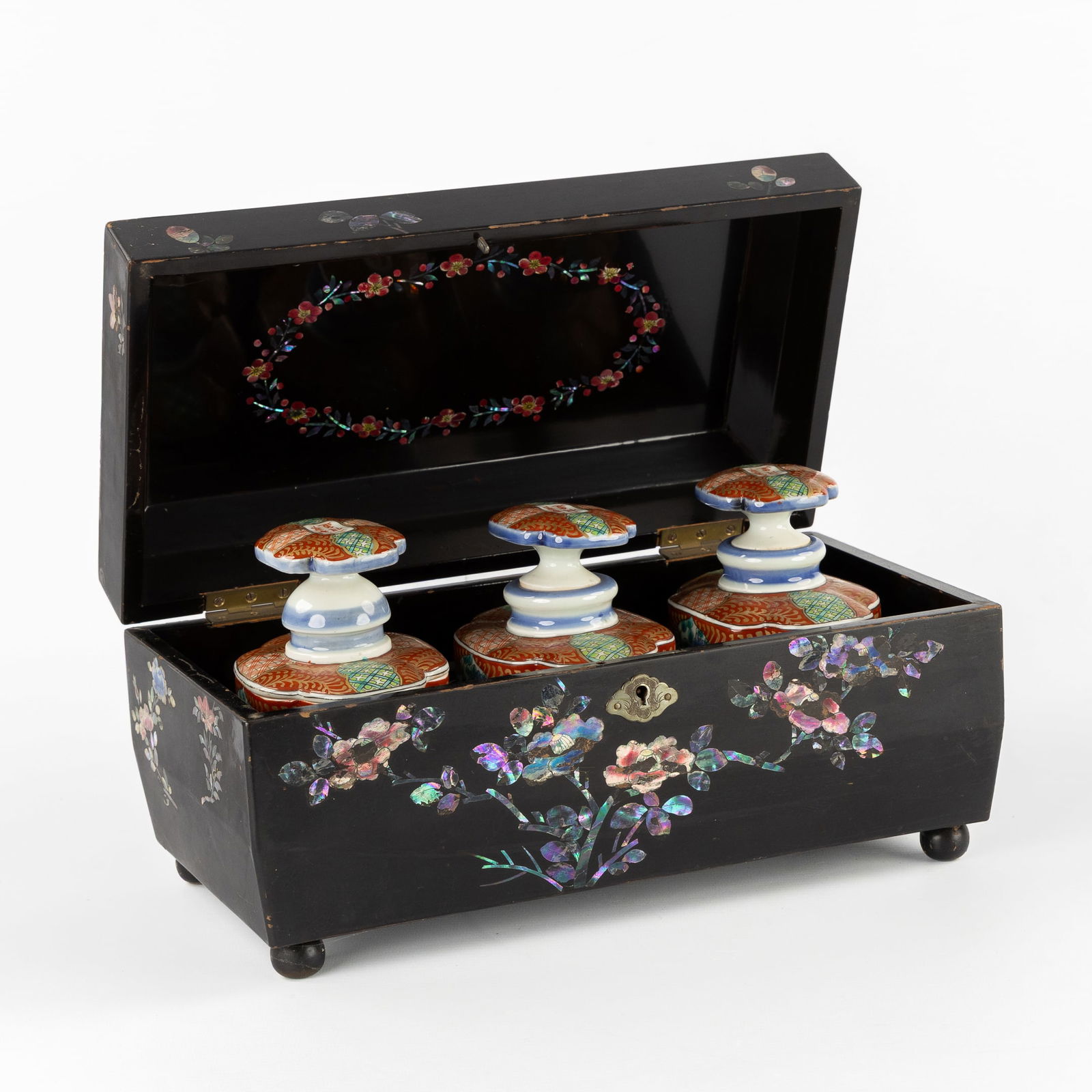 A Japanese Lacquered Tea Chest with Mother-of-Pearl Inlay and three Imari Porcelain Tea Caddies, (1 of 13)