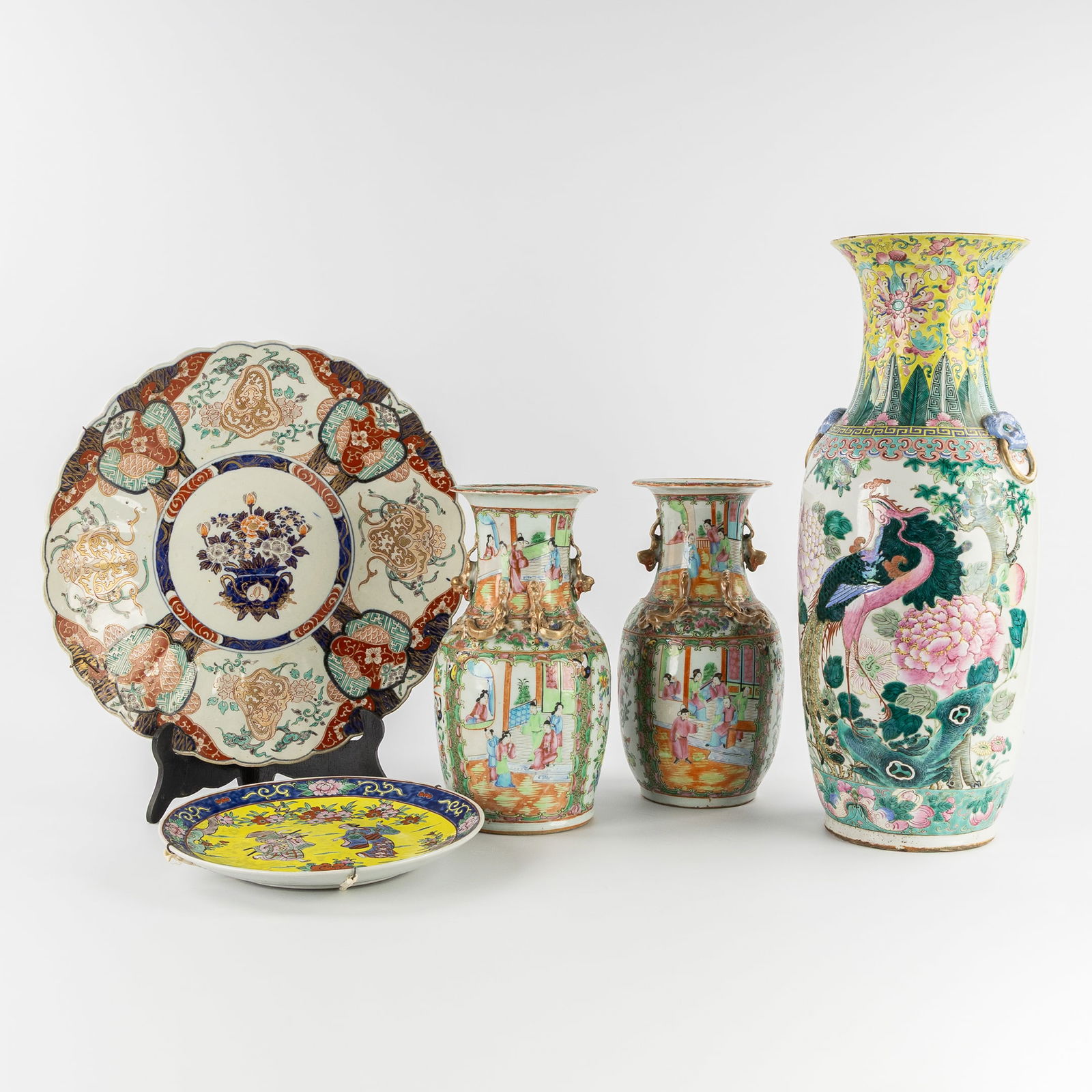 A Collection of Chinese and Japanese Porcelain, Famille Rose, Imari and Canton, Three Vases and Two: A Collection of Chinese and Japanese Porcelain, Famille Rose, Imari and Canton, Three Vases and Two Dishes. Chinese porcelain, Famille Rose.A dish or plate with a yellow ground, floral decoration, and