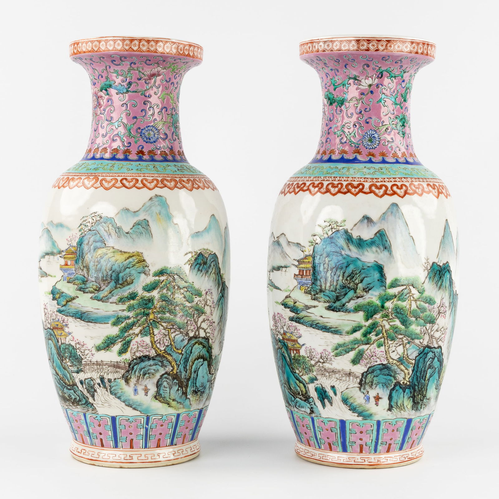 A Pair of Chinese Famille Rose Vases with a Landscape Decoration, Qianlong marked.: A Pair of Chinese Famille Rose Vases with a Landscape Decoration, Qianlong marked. Chinese porcelain, famille rose.Decorated with a landscape featuring a river and mountains, and calligraphy.Marked Qi