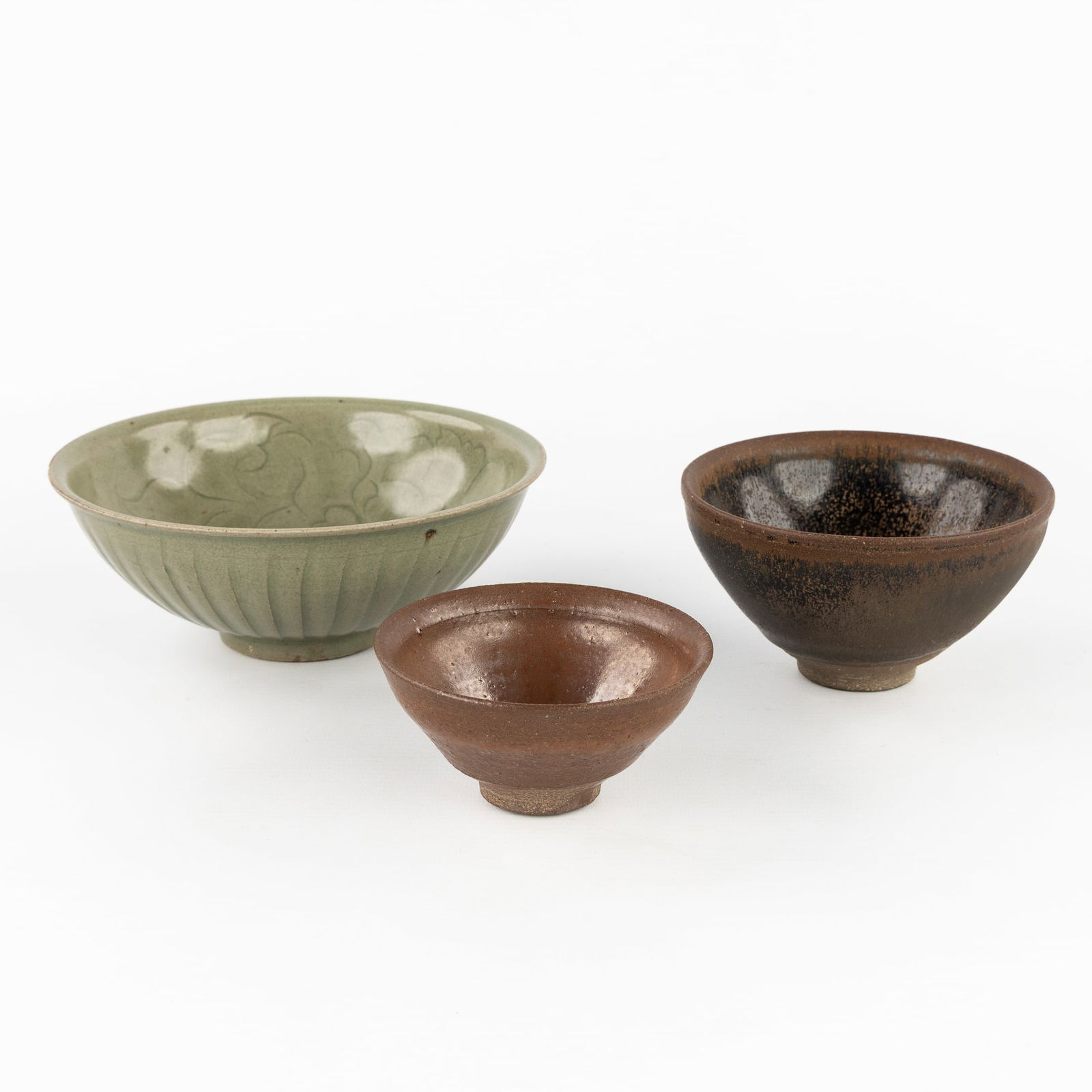 A Collection of Chinese Song Bowls, including a Yaozhou Celadon Lotus Bowl, a Jianyao 'Hare's Fur' (1 of 5)