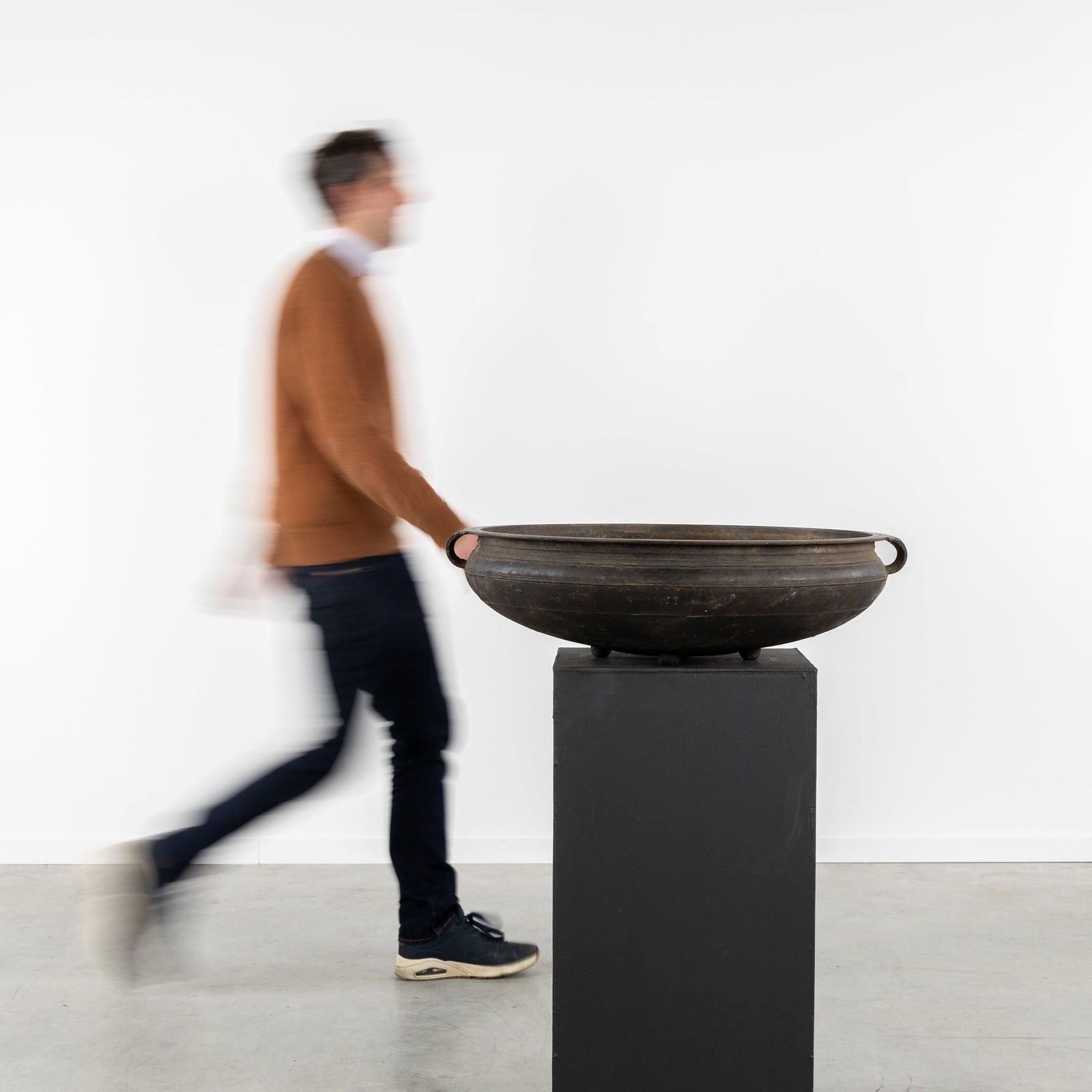 A Bronze Urli or Temple Bowl, Mounted on Ball Feet, India, 19th C.: A Bronze Urli or Temple Bowl, Mounted on Ball Feet, India, 19th century. Bronze. Temple bowl / Urli / Ourli Mounted on four ball feet. India, late 19th century.