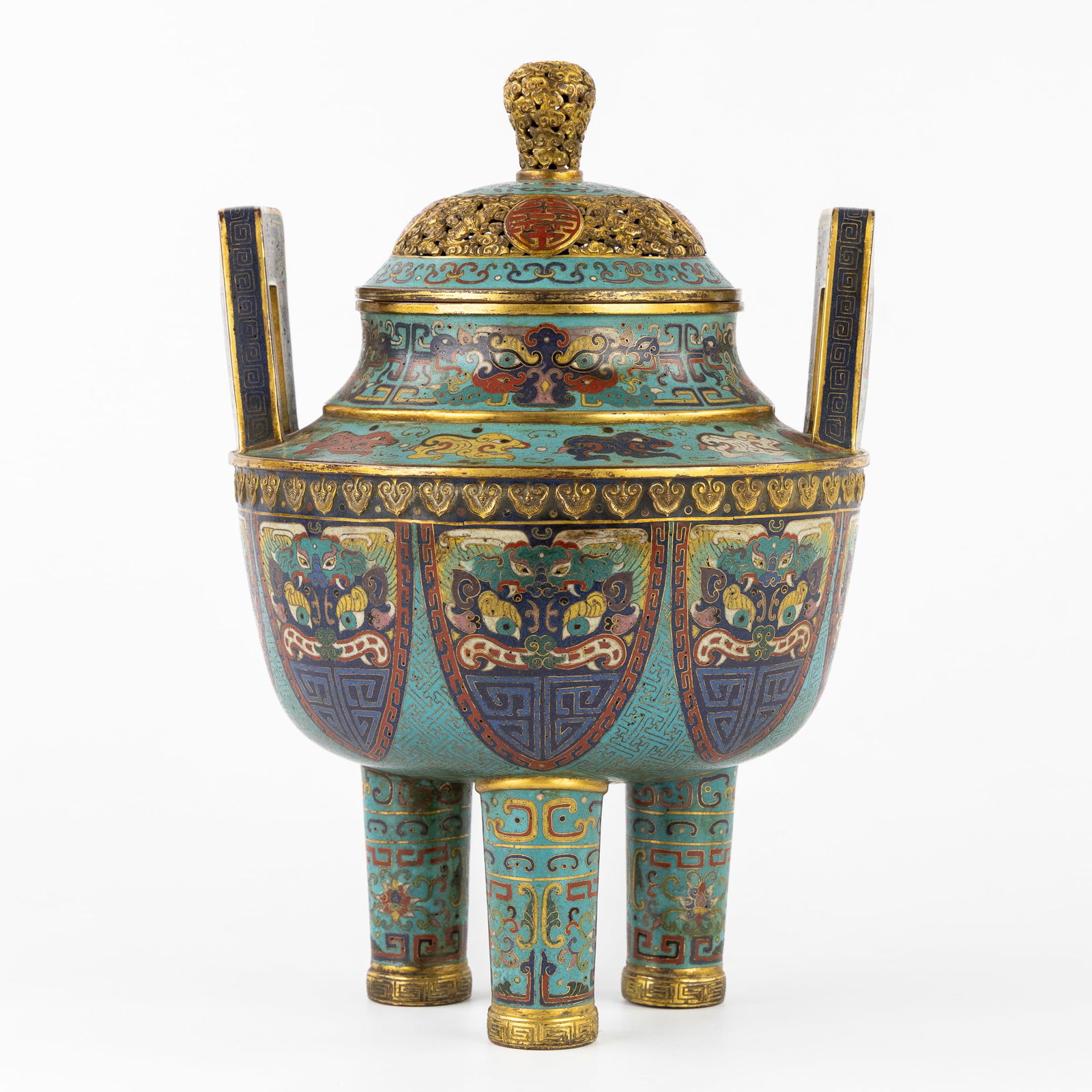 A Large Chinese Champlevé Incense Burner, decorated with Foo dogs, marked Qianlong.: A Large Chinese Champlevé Incense Burner, decorated with Foo dogs, marked Qianlong. Bronze with champlevé enamel and gilt finish. Incense burner on three legs, with raised handles and a lid. Decorat