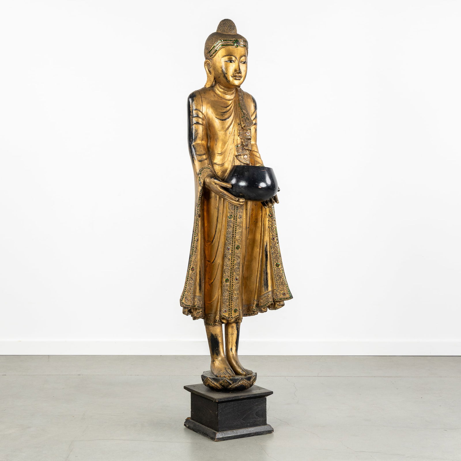 A Large Decorative Statue of a Standing Burmese Buddha with an Alms Bowl, Sculptured and Gilded (1 of 9)