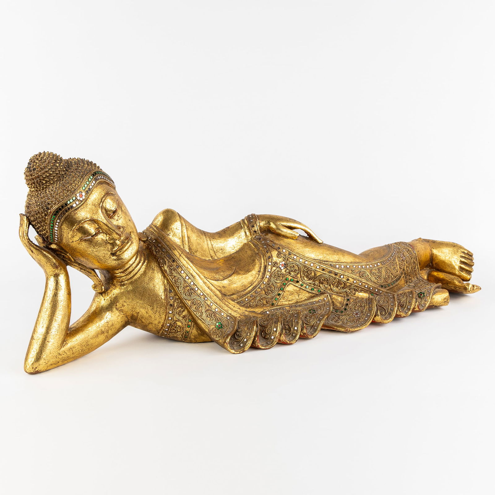 A Decorative Statue of a Reclining Burmese Buddha, Sculptured and Gilded Wood. (1 of 9)