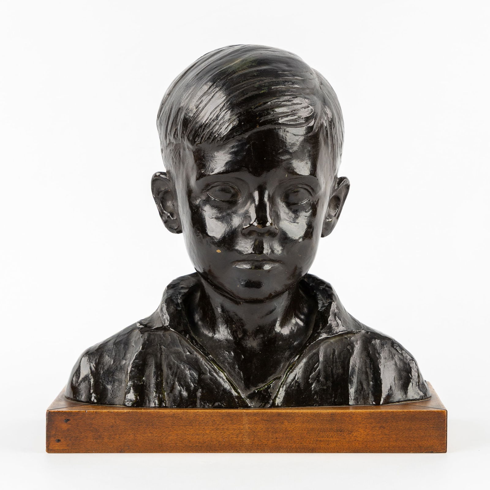 Simon Goossens (1893-1964) 'Bust of a Boy', patinated bronze.: Simon Goossens (1893-1964) 'Bust of a Boy', patinated bronze. Patinated bronze. Signed 'Simon Goossens'. Mounted on a wooden base.