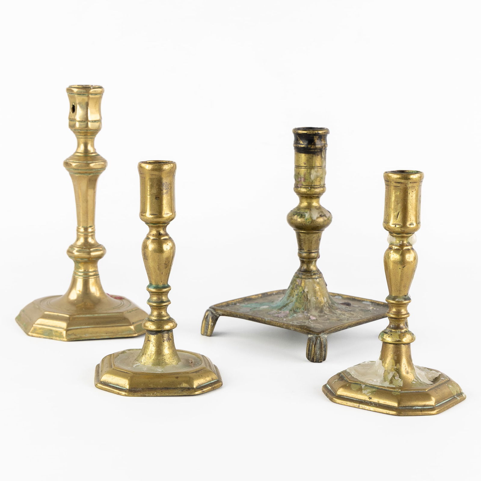 A Collection of Four Bronze Candlesticks, 18th/19th C. (1 of 5)