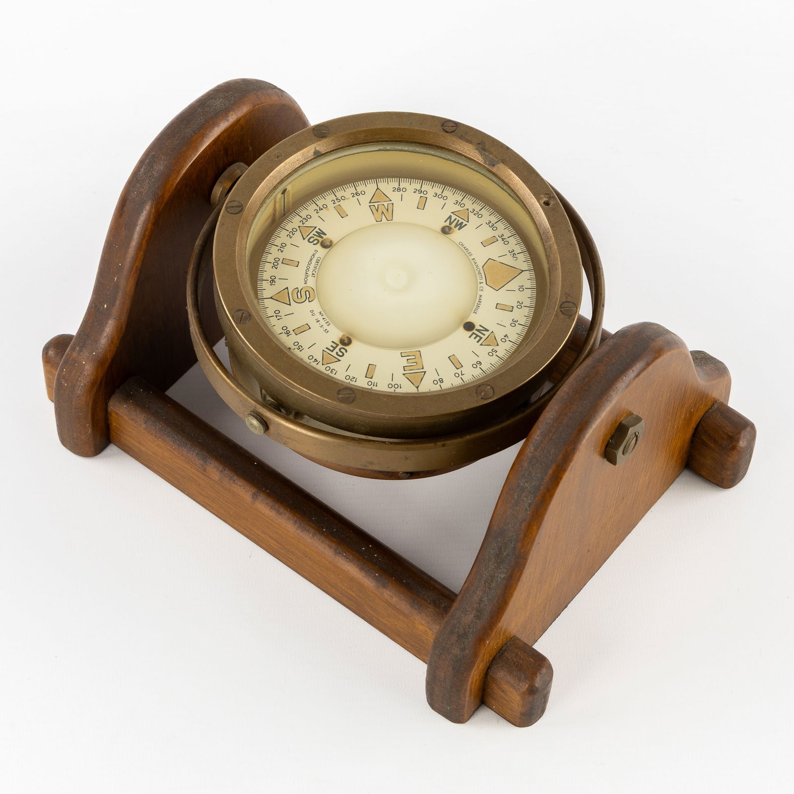 A Brass Ship's Compass, Charles Bianchetti & Cie, Marseille, mounted in a wooden table bracket. (1 of 5)