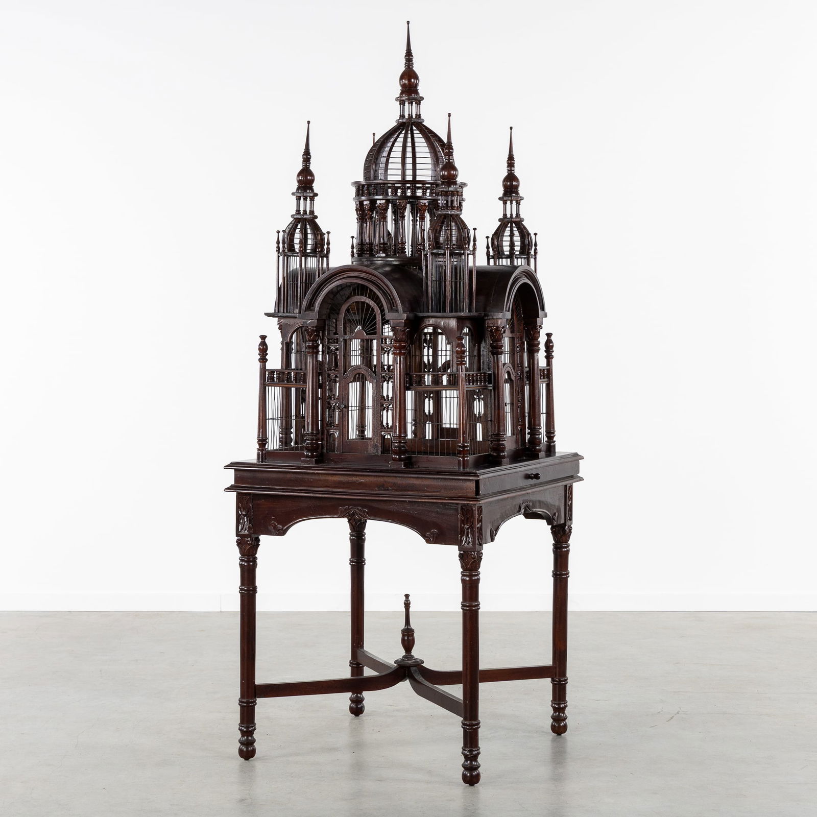 A Large and Decorative 'Cathedral' Birdcage, sculptured wood, Victorian style, 20th C.: A Large and Decorative 'Cathedral' Birdcage, sculptured wood, Victorian style, 20th century. Sculptured wood.Architectural birdcage in the shape of a cathedral, mounted on a table.Victorian style,