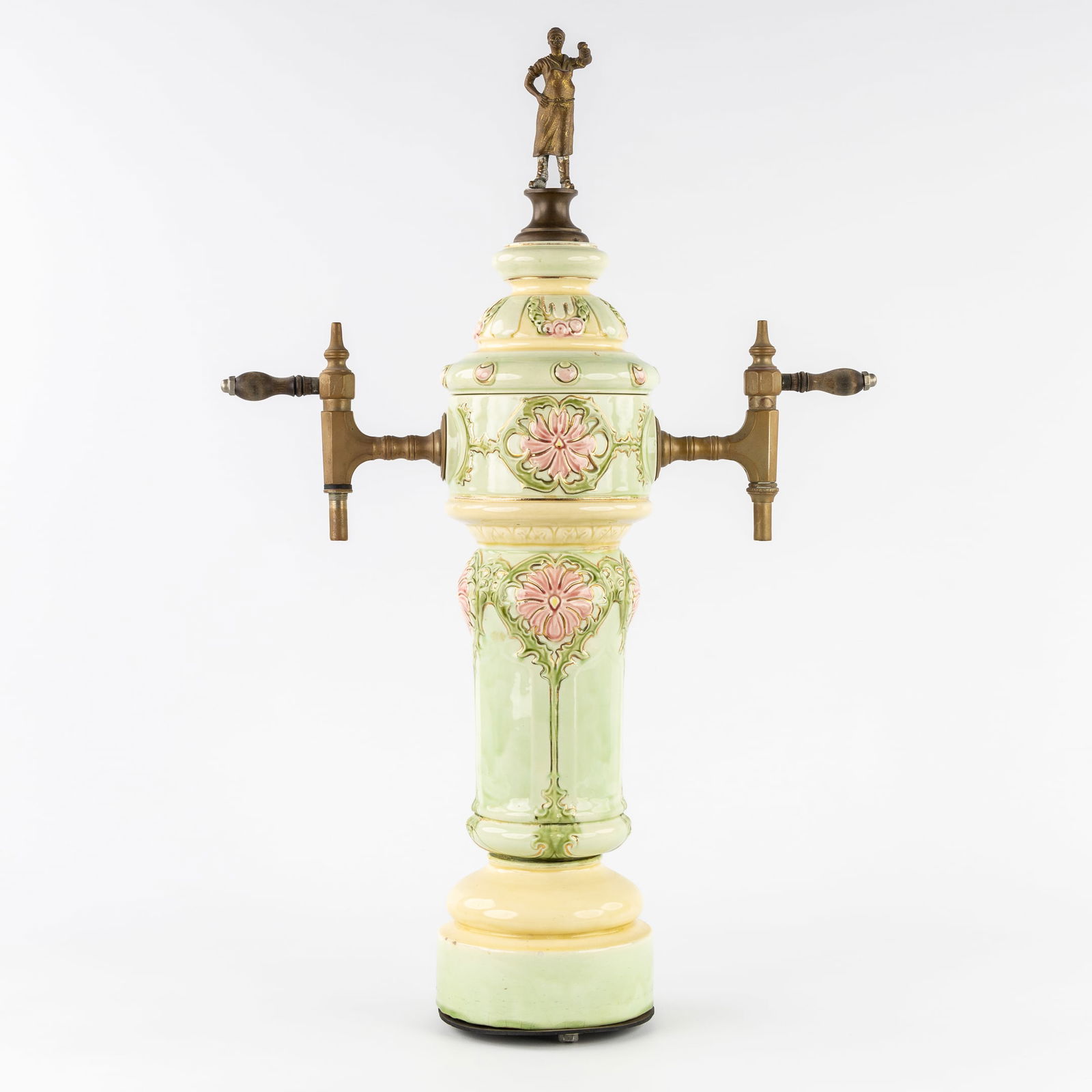 An Art Nouveau Beer Pump or Tap, Glazed Faience, Mounted with Bronze. Circa 1900.: An Art Nouveau Beer Pump or Tap, Glazed Faience, Mounted with Bronze. Circa 1900. Glazed faience.Beer pump or Beer tap with two bronze taps.Decorated with floral motifs and mounted with a bronze