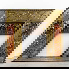 An Antique Fireplace Insert, Renaissance Style, Brass, Bronze and Ceramic.: An Antique Fireplace Insert, Renaissance Style, Brass, Bronze and Ceramic. Brass and bronze, finished with ceramic tiles.Fireplace insert, fireplace surround.Decorated with a child's head, ribbed mold
