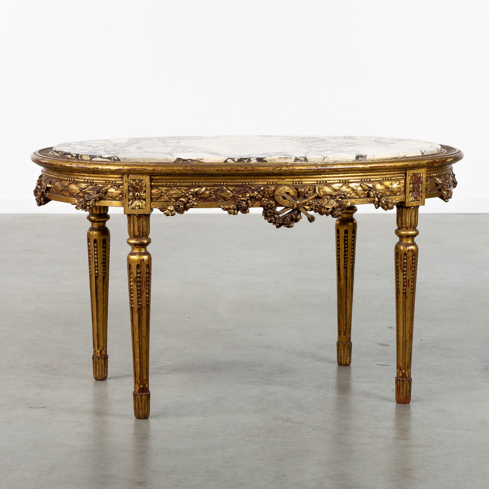 A Wood-sculptured and Gilded Side Table with a Marble Top. Louis XVI style. (1 of 8)