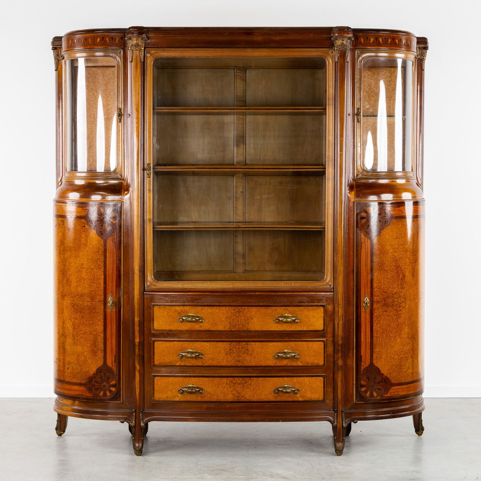Maison Franck, A Bookcase or Display Cabinet, Marquetry and Burl Wood Veneer, Art Nouveau, Antwerp,: Maison Franck, A Bookcase or Display Cabinet, Marquetry and Burl Wood Veneer, Art Nouveau, Antwerp, Circa 1920. (Burl wood) veneer and (curved) glass.Bookcase or display cabinet with three