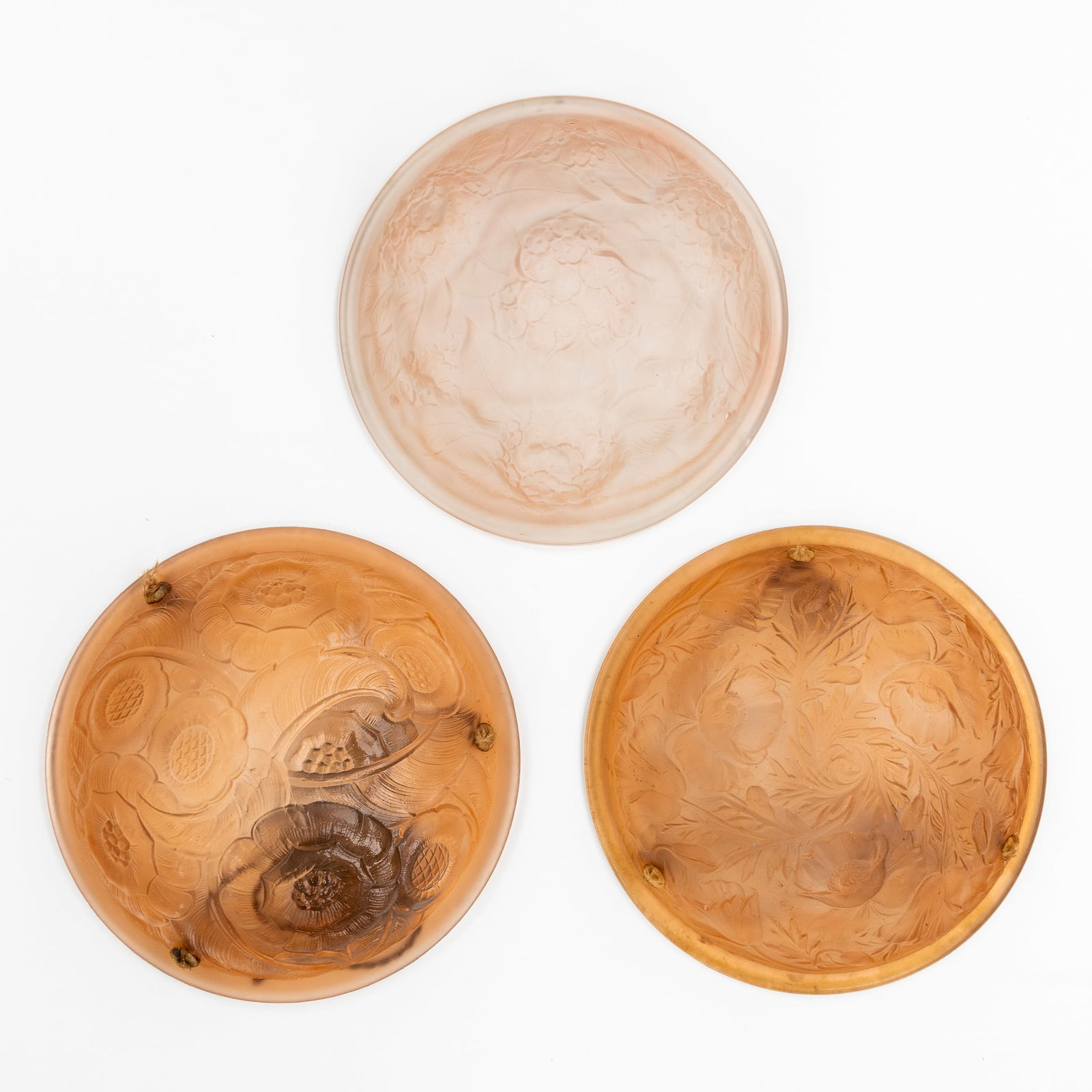 Three Art Deco Ceiling Lamps or Coupes, 'Vieux Rose' pressed glass, France, circa 1930.: Three Art Deco Ceiling Lamps or Coupes, 'Vieux Rose' pressed glass, France, circa 1930. Coloured (vieux rose) and pressed glass.Floral decorations.Unmarked. D: 35,5 cm / D: 35,5 cm / D: 35 cm