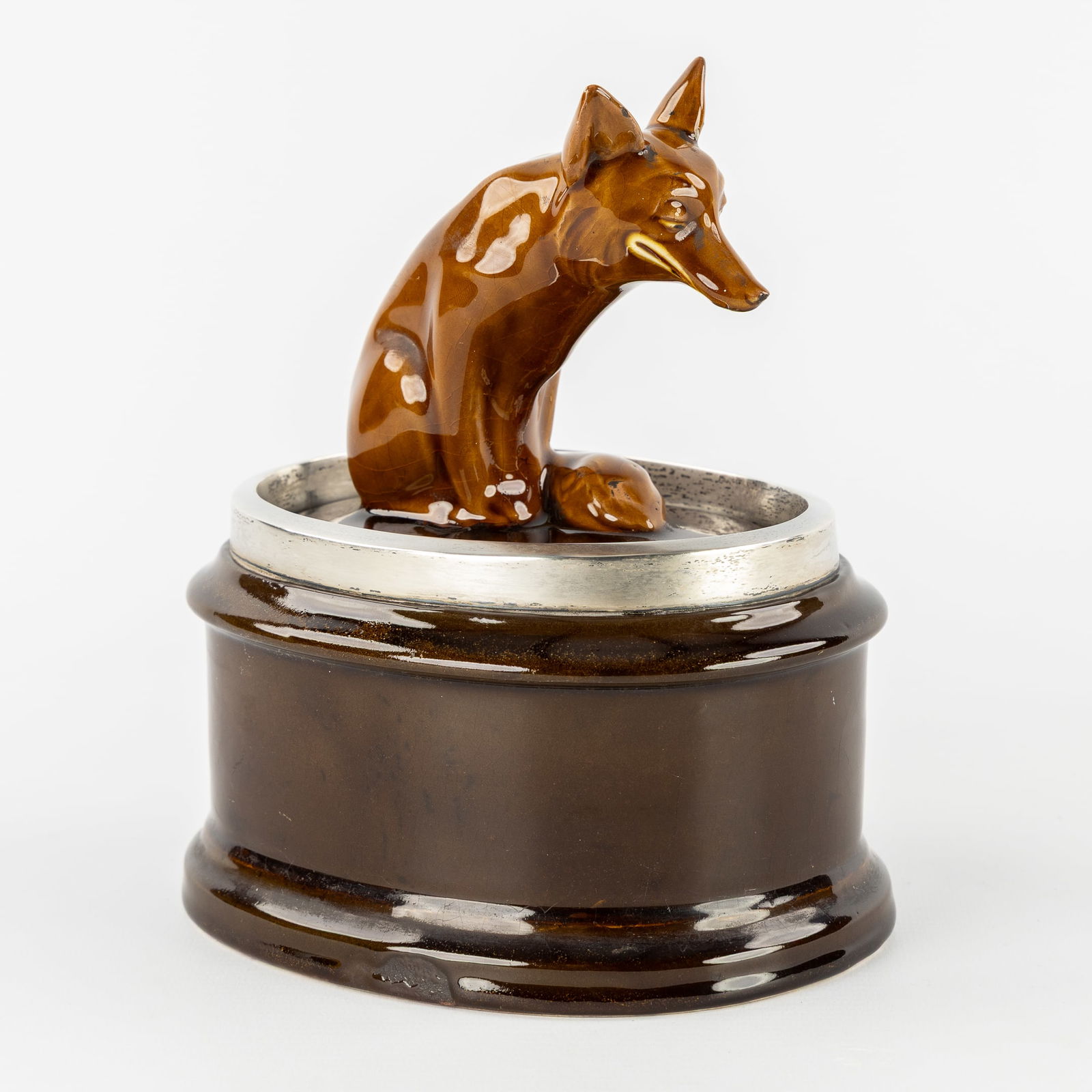 Royal Doulton, A Tobacco Jar with a Fox, Glazed Ceramic with a Silver Mount, England, 1911.: Royal Doulton, A Tobacco Jar with a Fox, Glazed Ceramic with a Silver Mount, England, 1911. Glazed ceramic and silver. Silver mount, marked Sterling, London, date letter q for 1911, George Betjemann &
