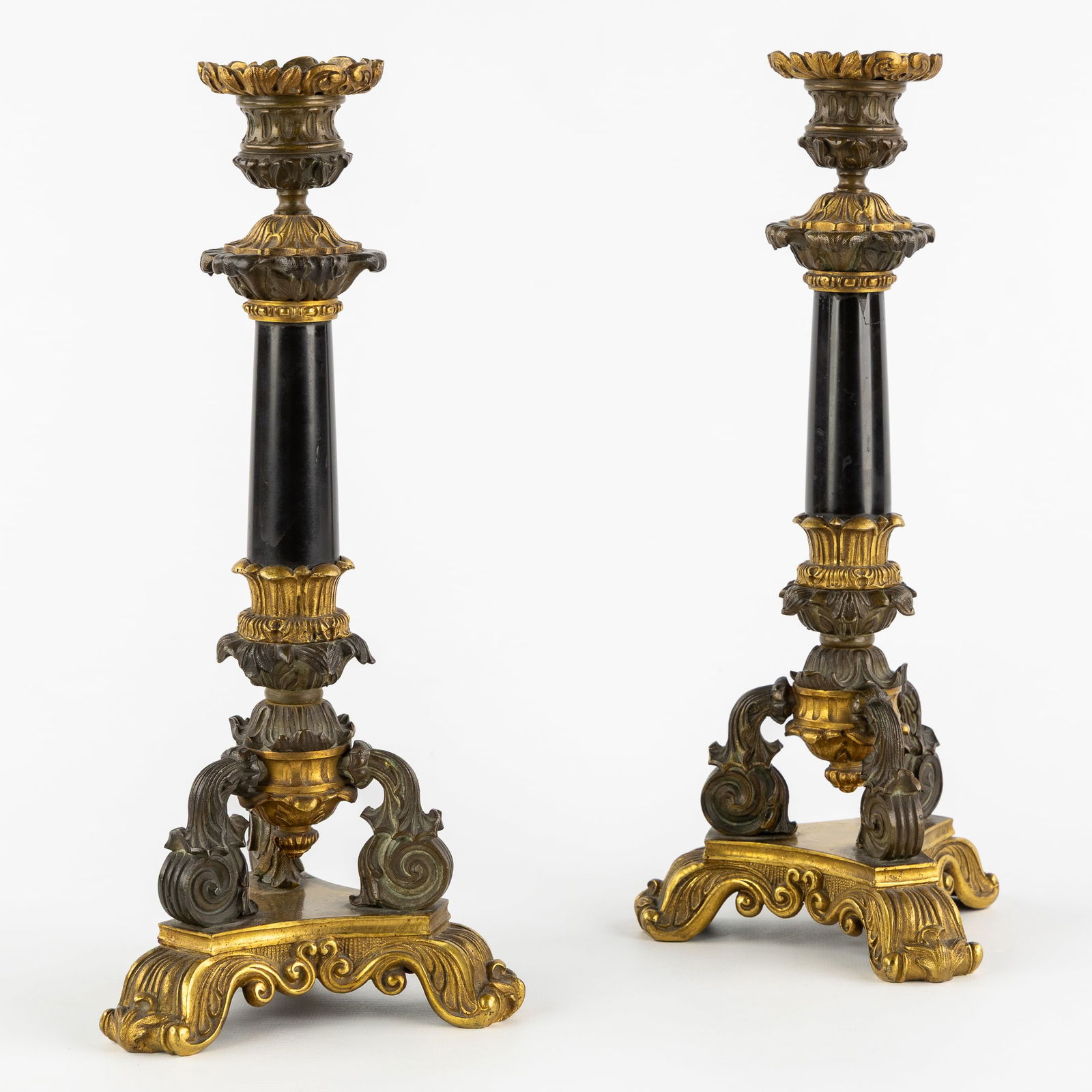 A Pair of Antique Candlesticks, Restoration Style, Louis Philippe, Gilded and Patinated Bronze and: A Pair of Antique Candlesticks, Restoration Style, Louis Philippe, Gilded and Patinated Bronze and Marble, France, circa 1850. Gilded and patinated bronze and black marble.Finely decorated candlestick