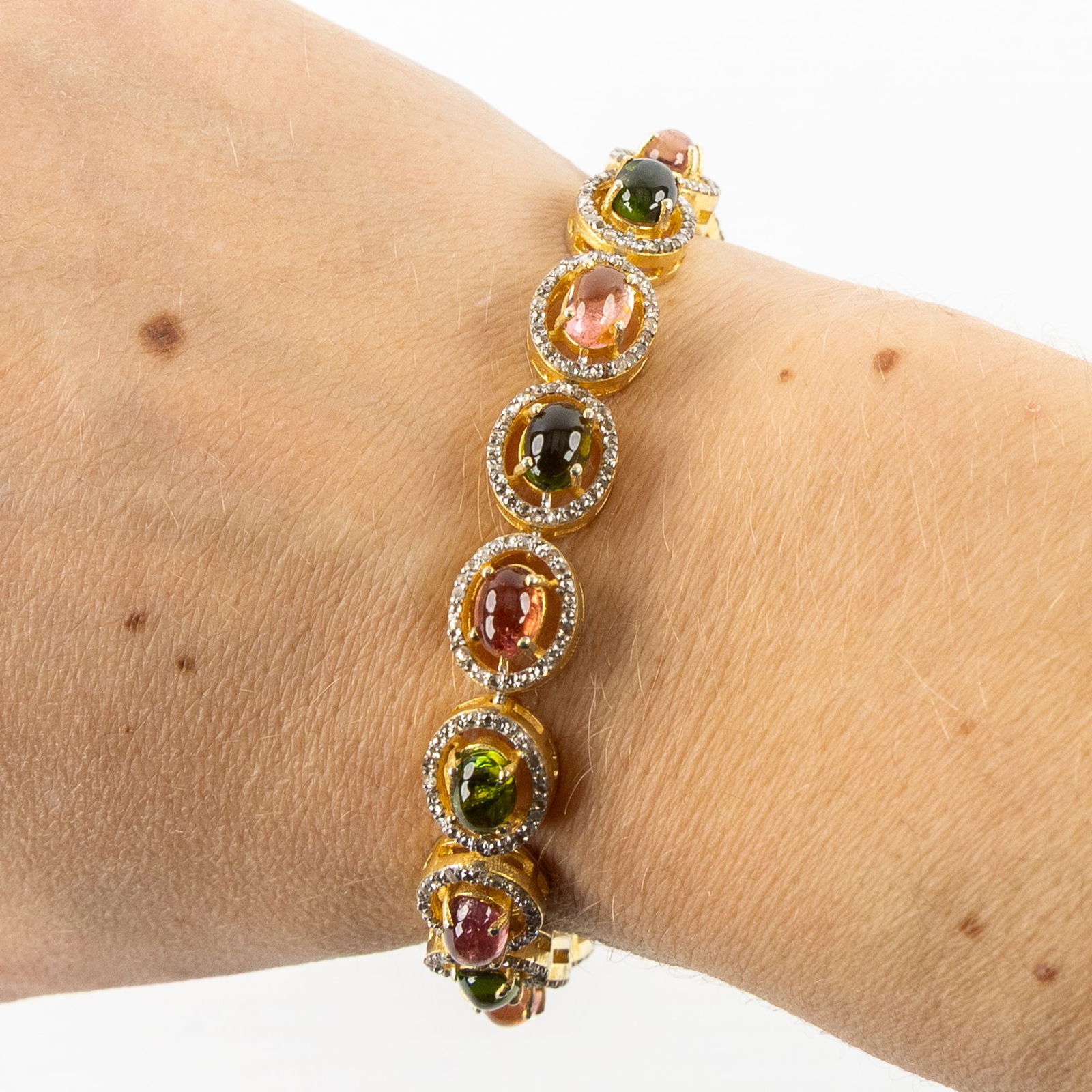 A bracelet, vermeil mounted with tourmaline cabochons. 24.78g. (1 of 7)