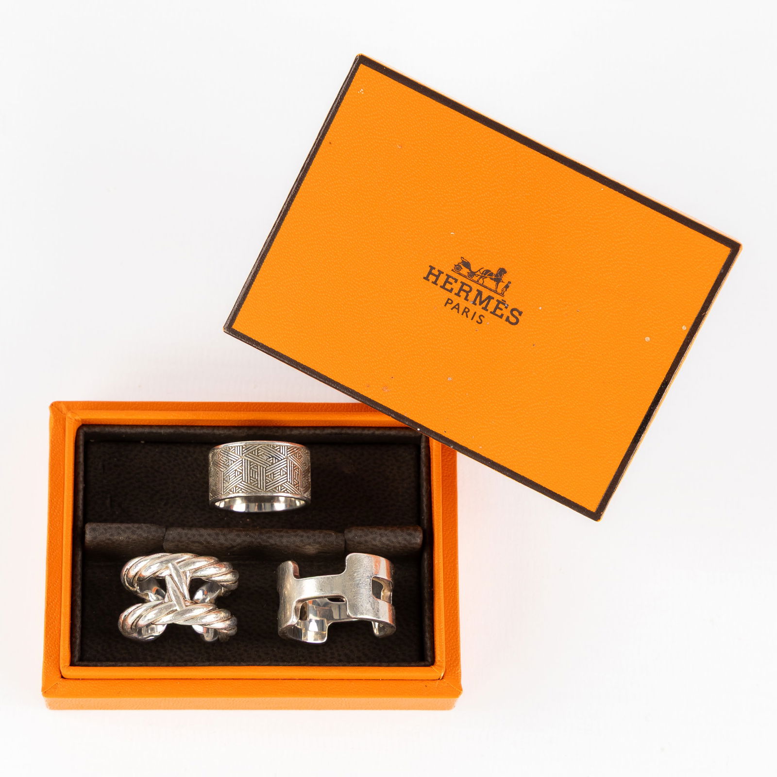 Hermès, three silver rings, in the original storage box. Silver, 36.85g. (1 of 9)