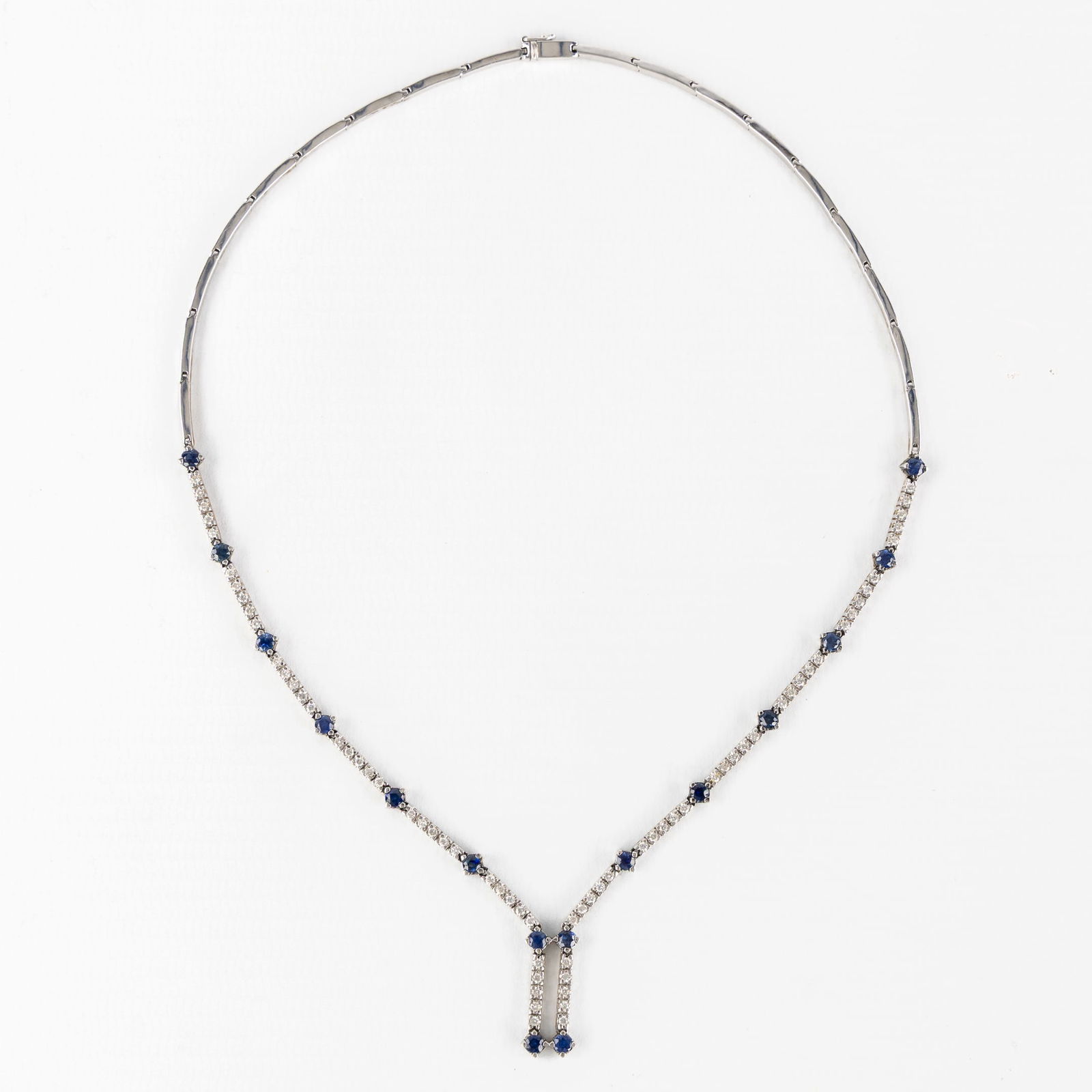 An 18kt white gold necklace set with brilliant-cut sapphires and diamonds. 17.38g. (1 of 4)
